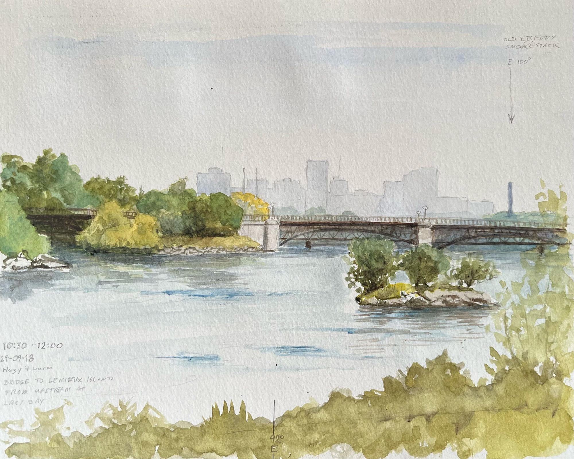 Watercolour sketch of a river with some rocky forested islands, a pair of iron bridges one behind the other, and a city skyline in the background. The painting is annotated with the date, time, weather conditions, location, and compass bearings.  10:30-12:00, 24-09-18, hazy and warm, bridge to Lemieux Island from upstream at Lazy Bay”. The centre of the painting is marked as 92 degrees east. A tall chimney in the distance on the right is labeled “E. B. Eddy smokestack, 100 degrees East.