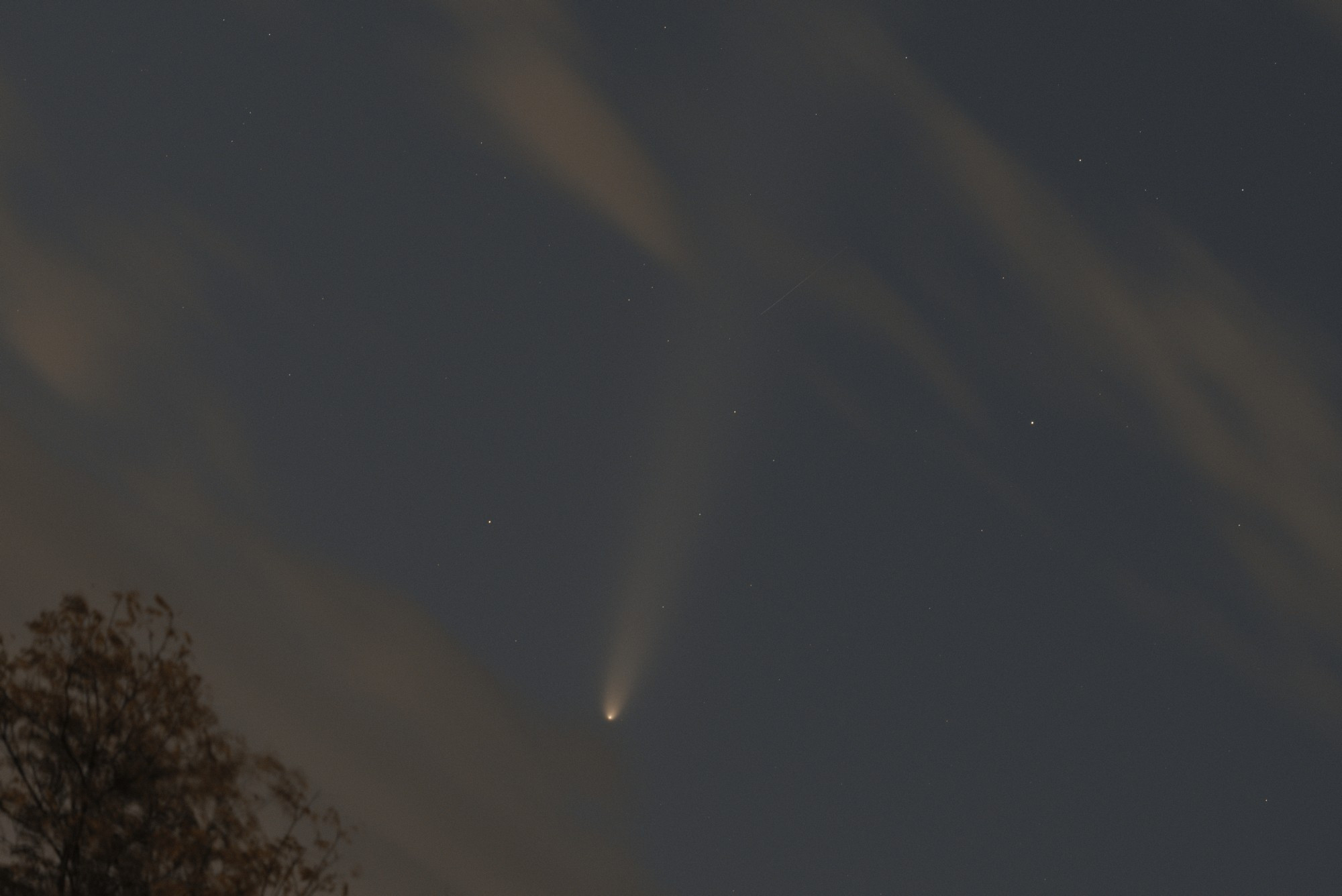 Comet amid clouds in the night sky