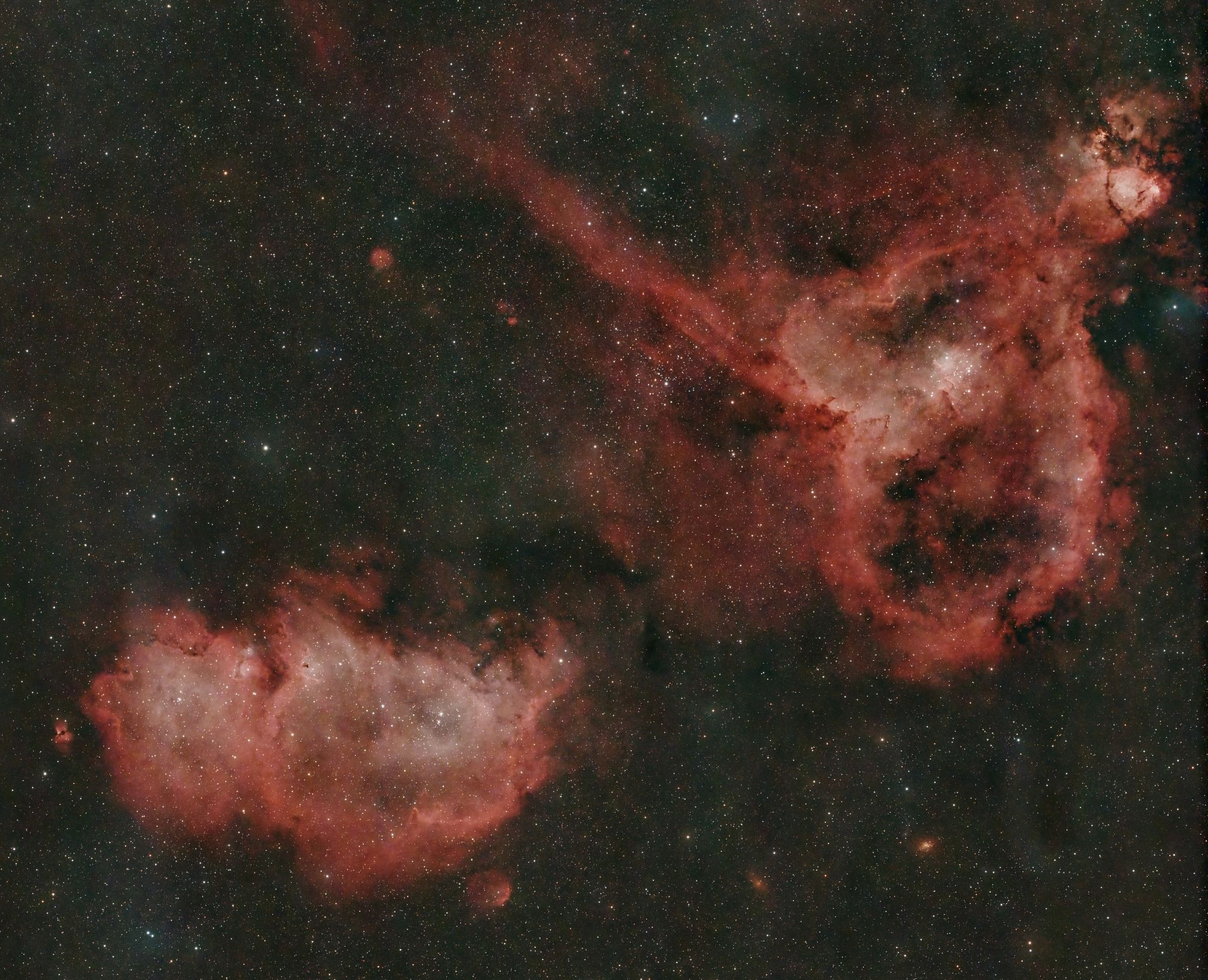 Interstellar nebulae, one resembles a heart and the other a running pig (it's supposed to be a soul, but who knows what one of those looks like?)