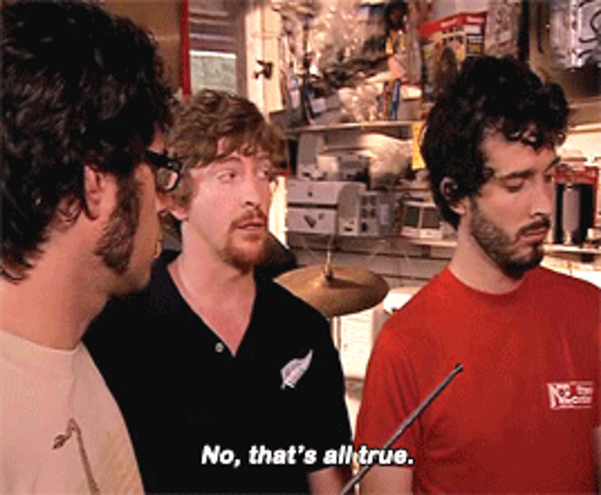 A gif from the TV show Flight of the Conchords where Jemaine, Bret, and Murray are talking about how Fleetwood Mac made some of their best music while embroiled in a love square. Bret nods and says "Rumours." Murray answers, "No, that's all true."