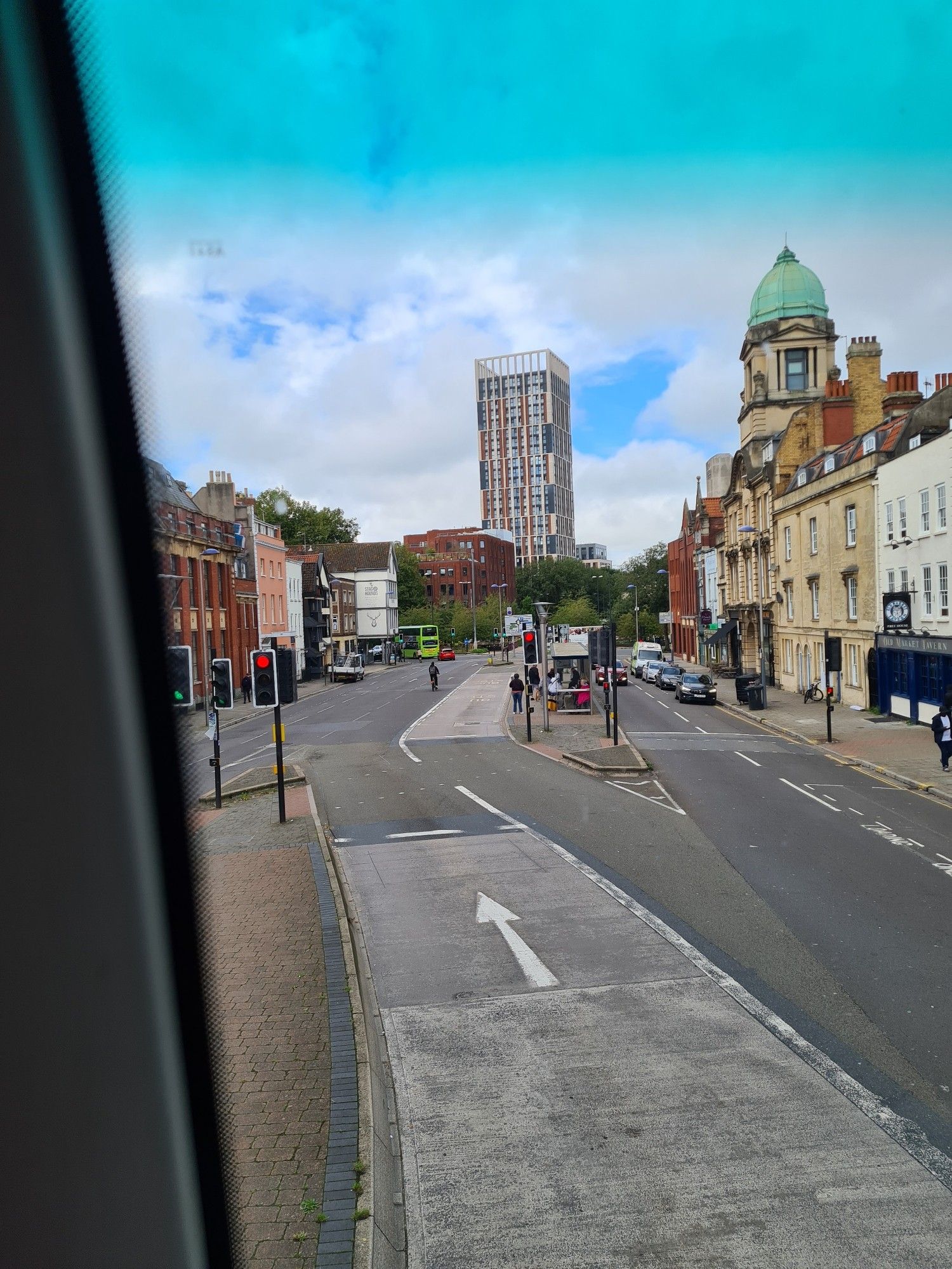 A photo from the top deck of a bus looking out of the front of Old Market Street and the monstrous Castle Park View building.