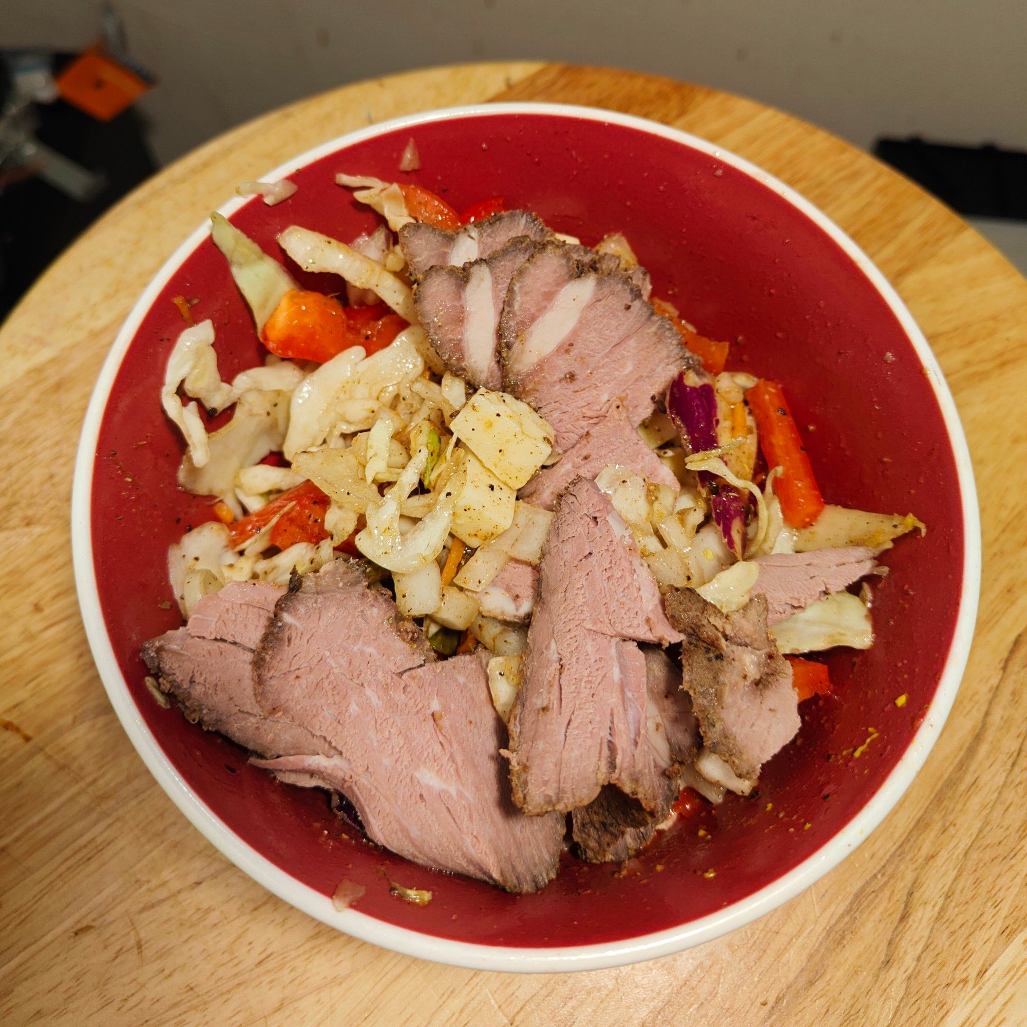 Medium sous-vide bottom round over cabbage salad.