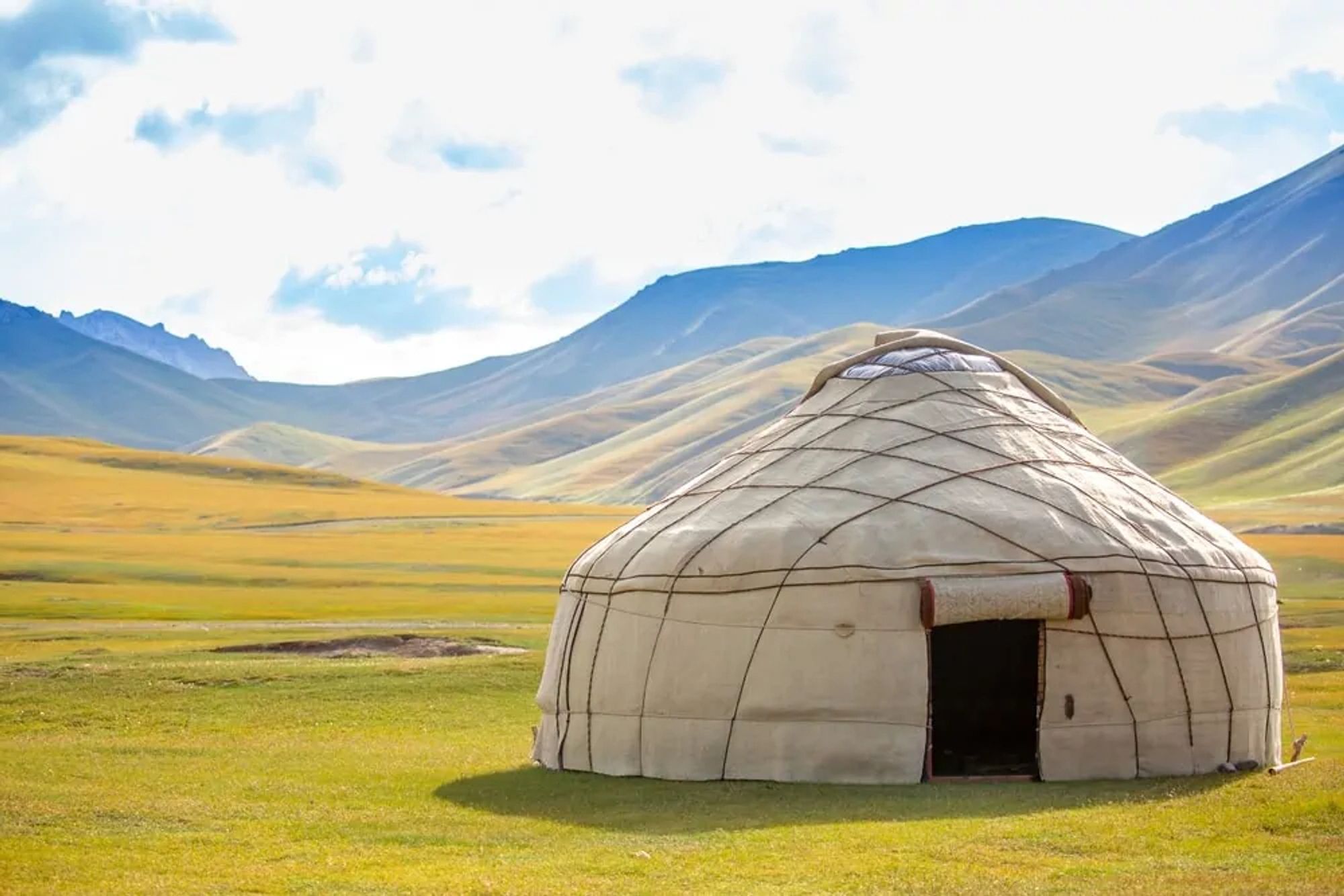 From Old Turkic yurt, from Proto-Turkic *jūrt ("dwelling place, home").