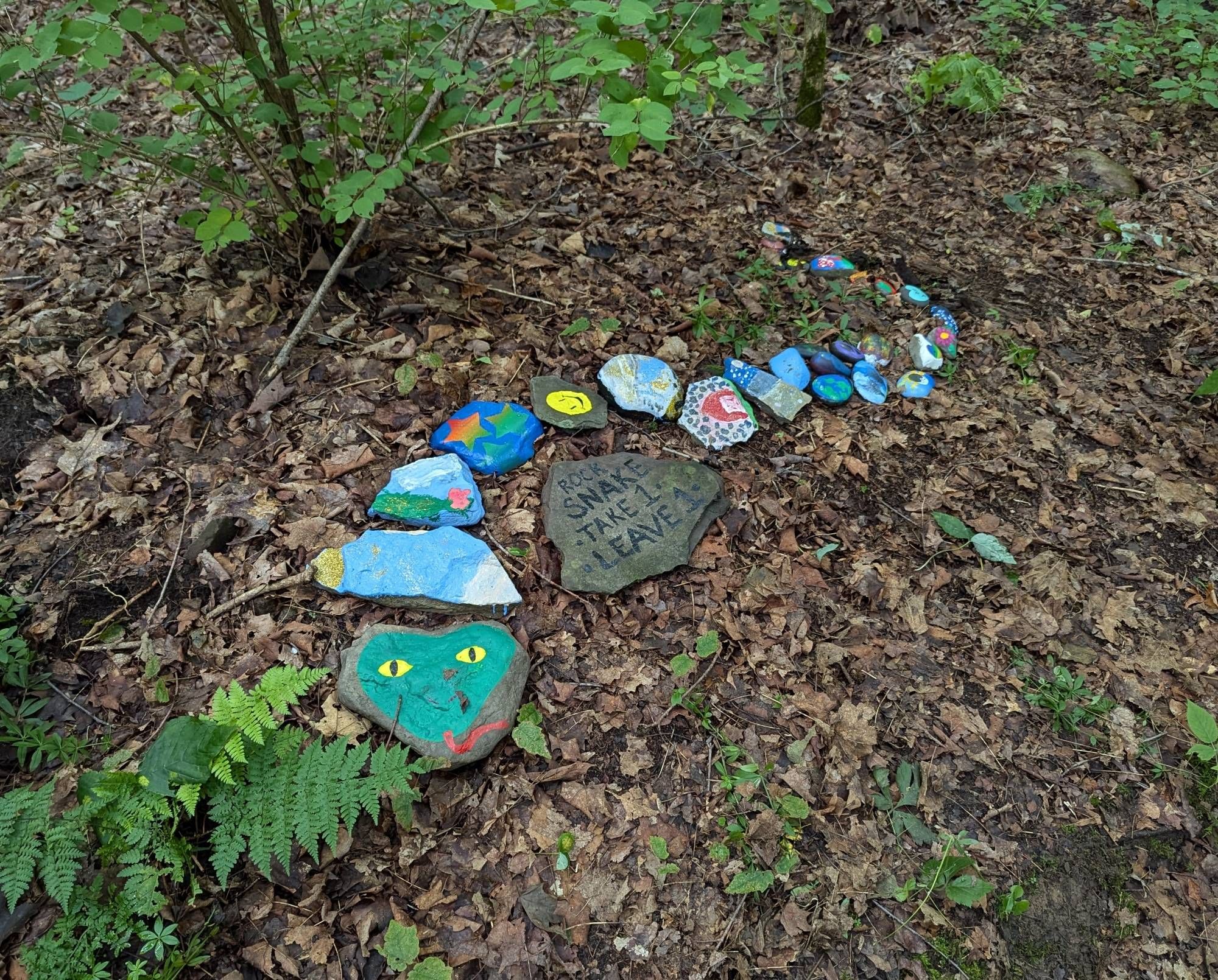 Kindness Rocks in the shape of a snake.