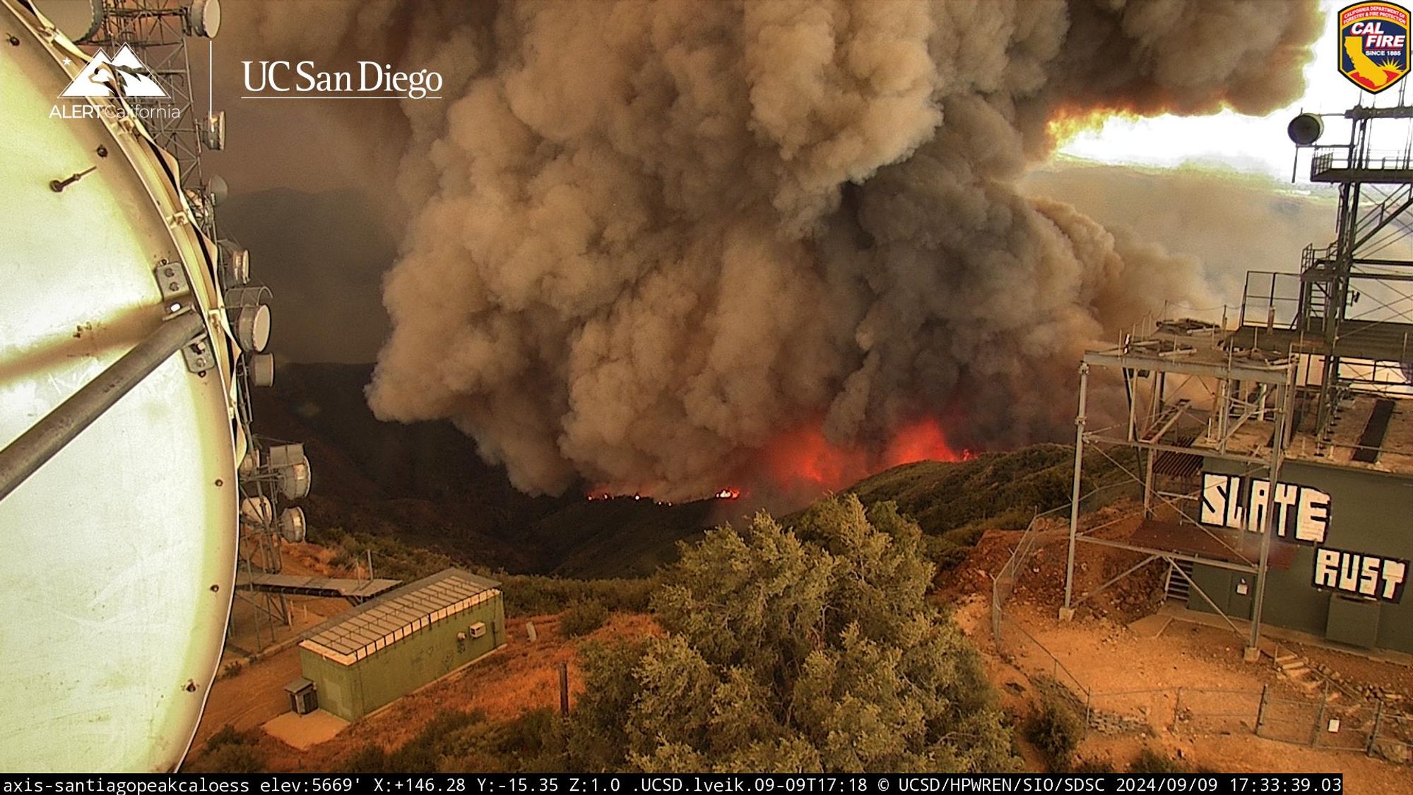 Still frame from wildfire camera network depicting Airport Fire burning aggressively this evening.