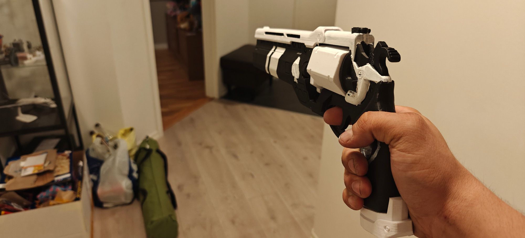 Same printed hand cannon being aimed. The hammer is pulled back