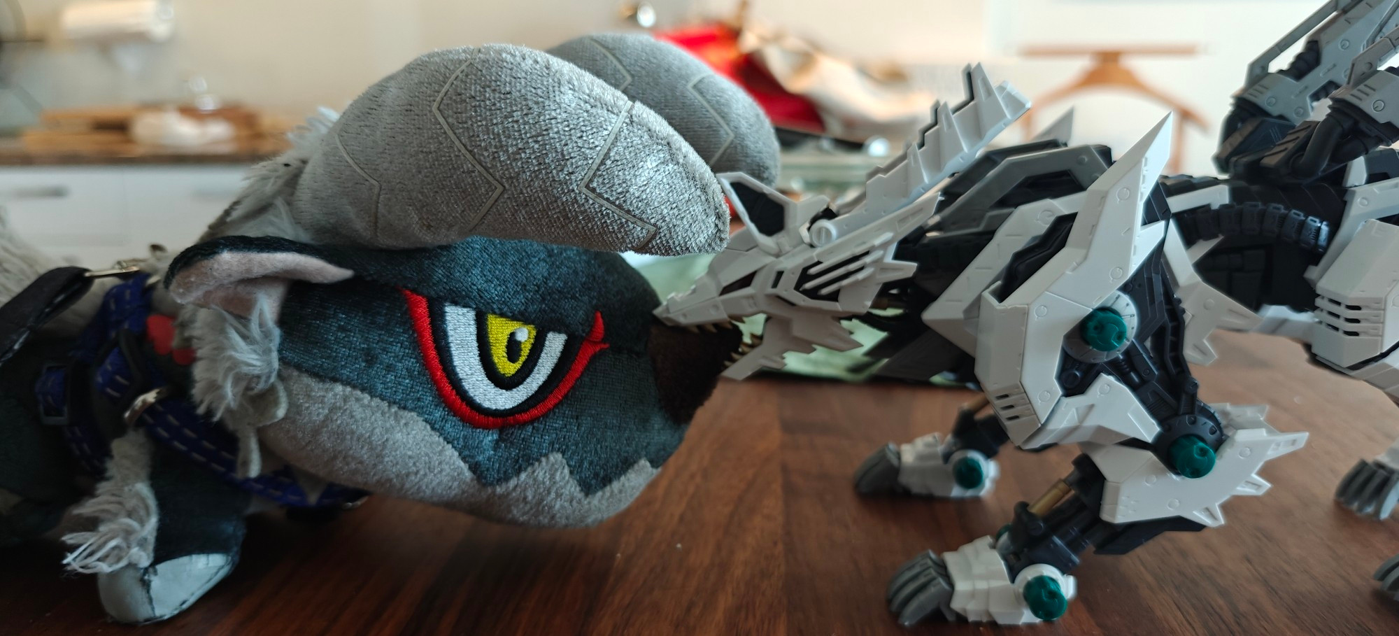 Köing Wolf Zoid biting a deformed Stygian Zinogre plushie's nose