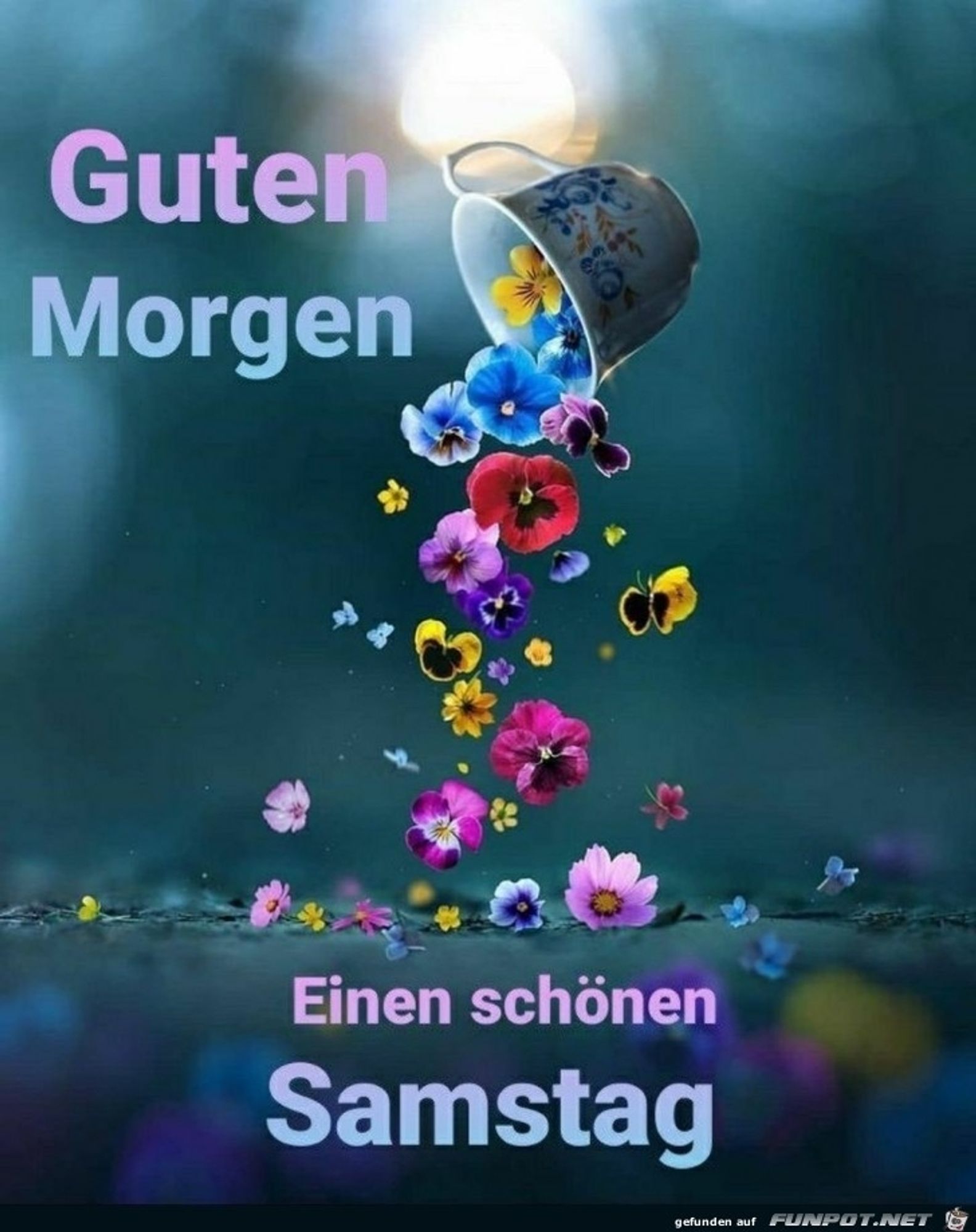 Eine Tasse hängt schräg, mit der Öffnung halb nach unten zeigend, in der Luft über einer Wasserfläche. Aus ihr fallen bunte Blüten ins Wasser.  Schrift: "Guten Morgen.  Einen schönen Samstag"