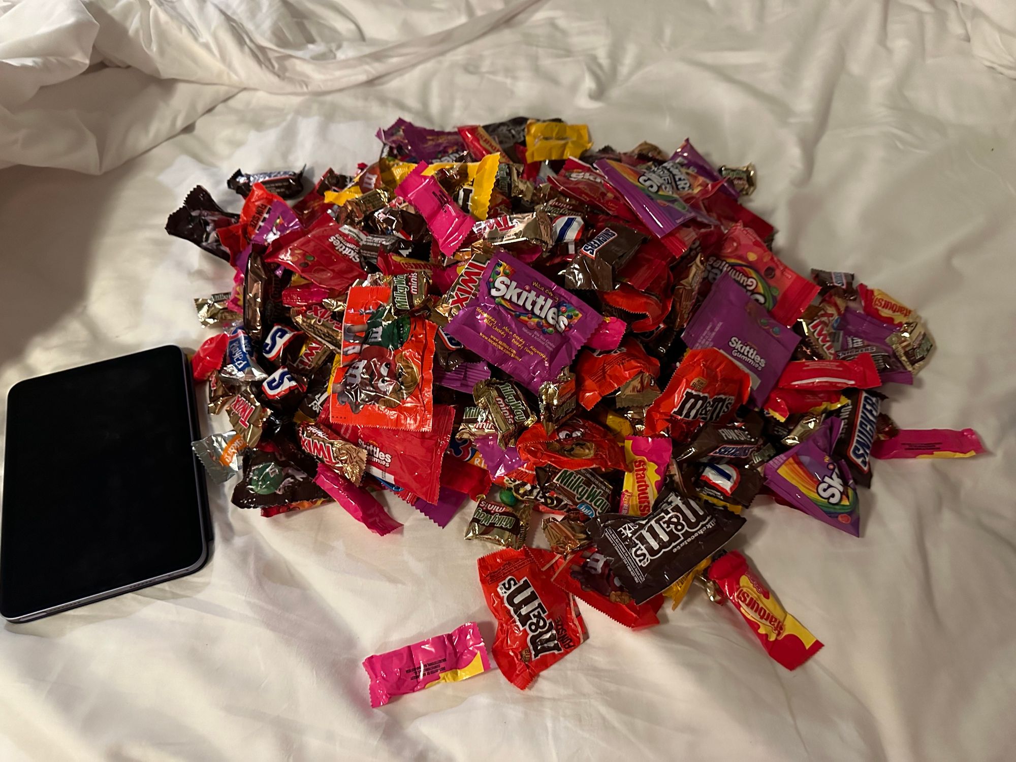 Pile of candy with iPad mini for scale