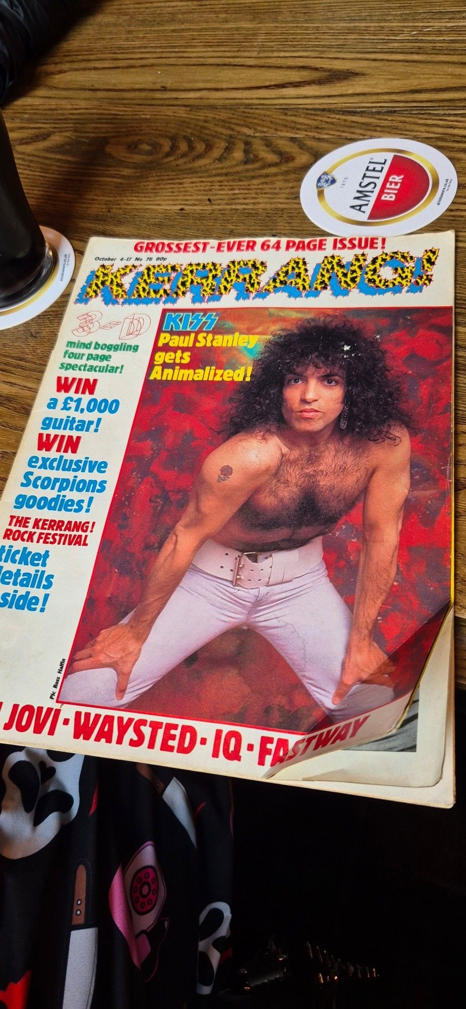 The cover of issue 78 of Kerrang magazine, from October 1984. The Kerrang logo is in leopard print and Paul Stanley, sans make up and topless, is on the cover