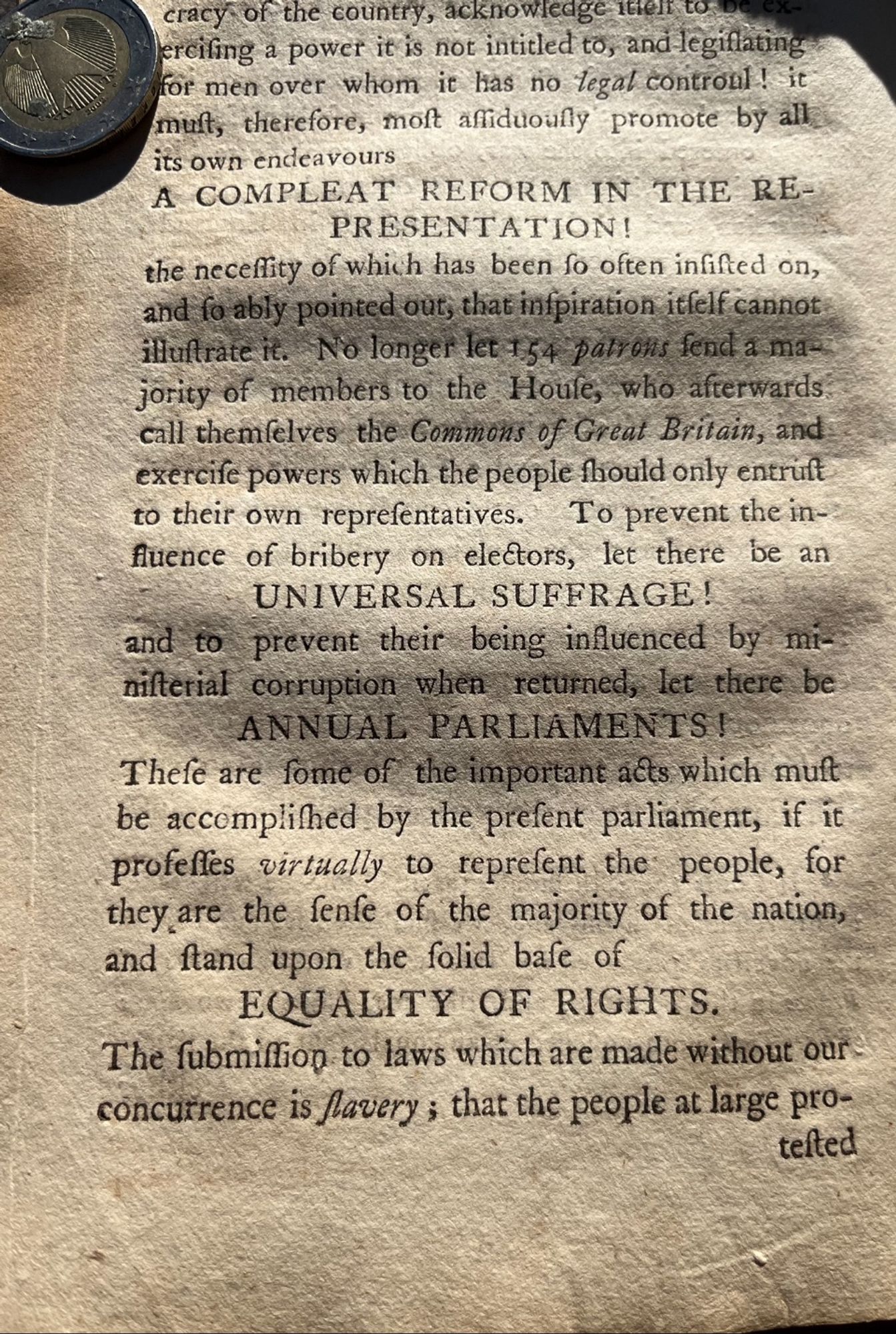 A page from a pamphlet published in 1796. The black type is on laid paper and shadows are visible from creases on the paper.