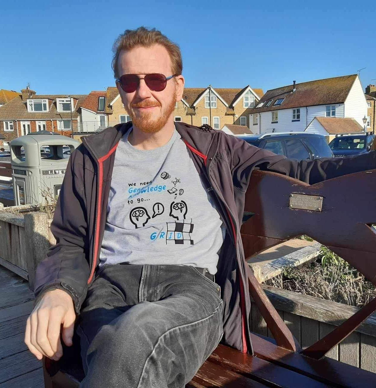 Trying to look cool on the Cushing memorial bench, in Off Grid t-shirt plus used-to-be-waterproof coat.