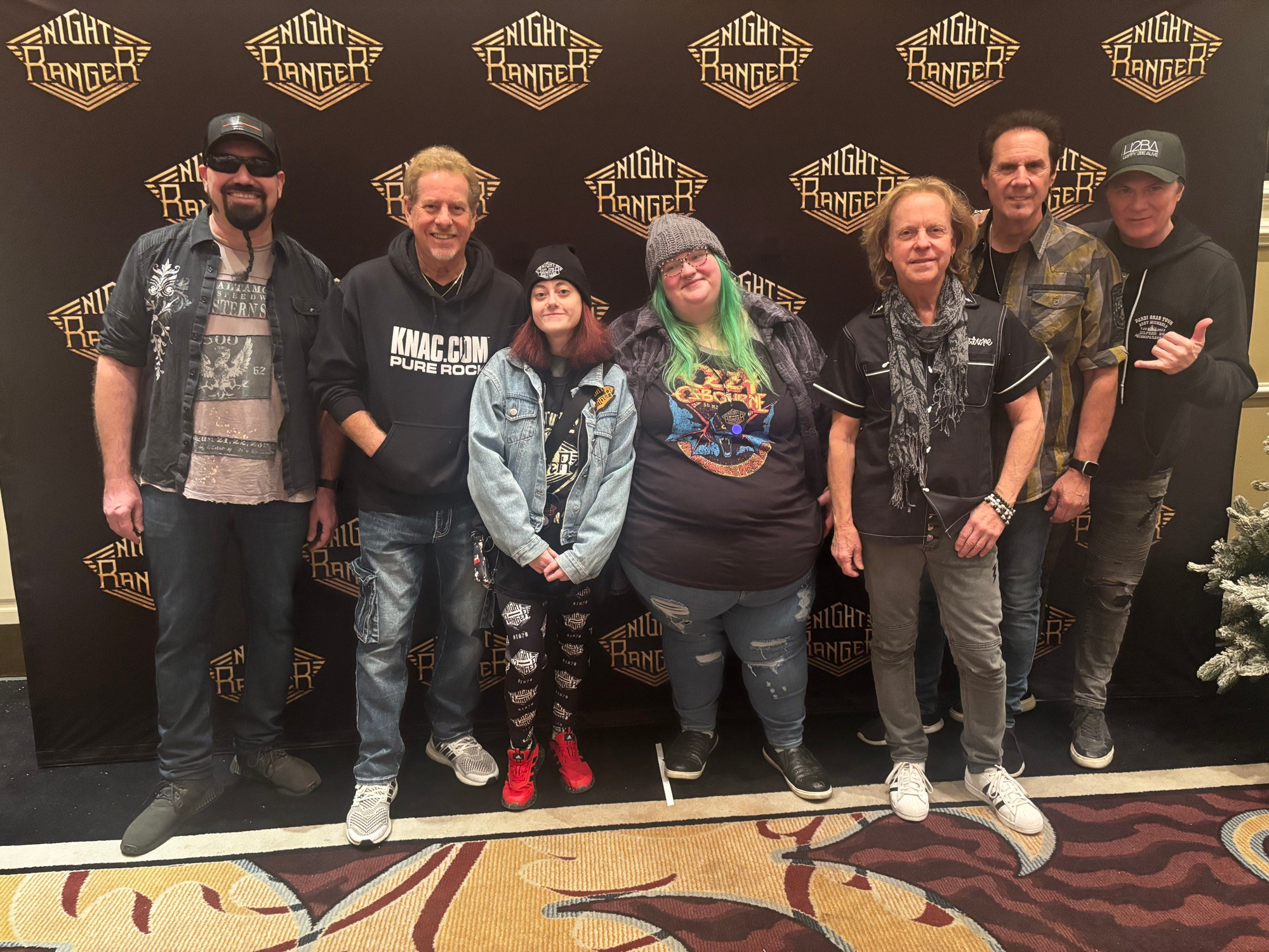 A selfie of the author, their friend, and Night Ranger