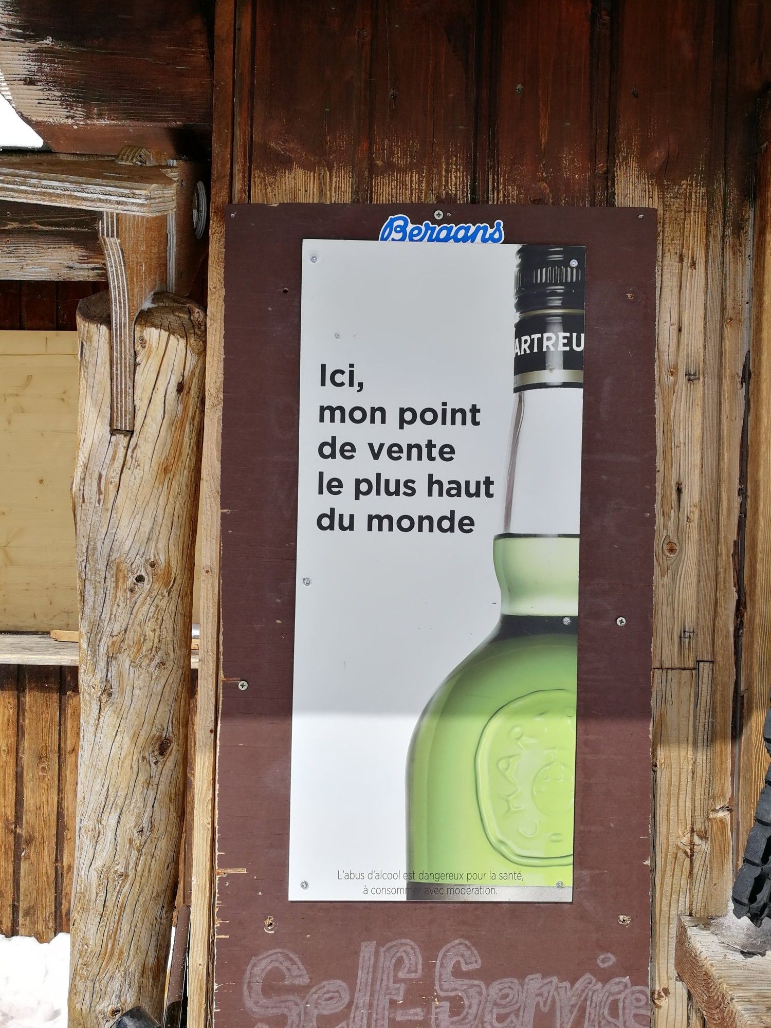 Poster showing a bottle of green Chartreuse which states "This is my  highest point of sale in the world"