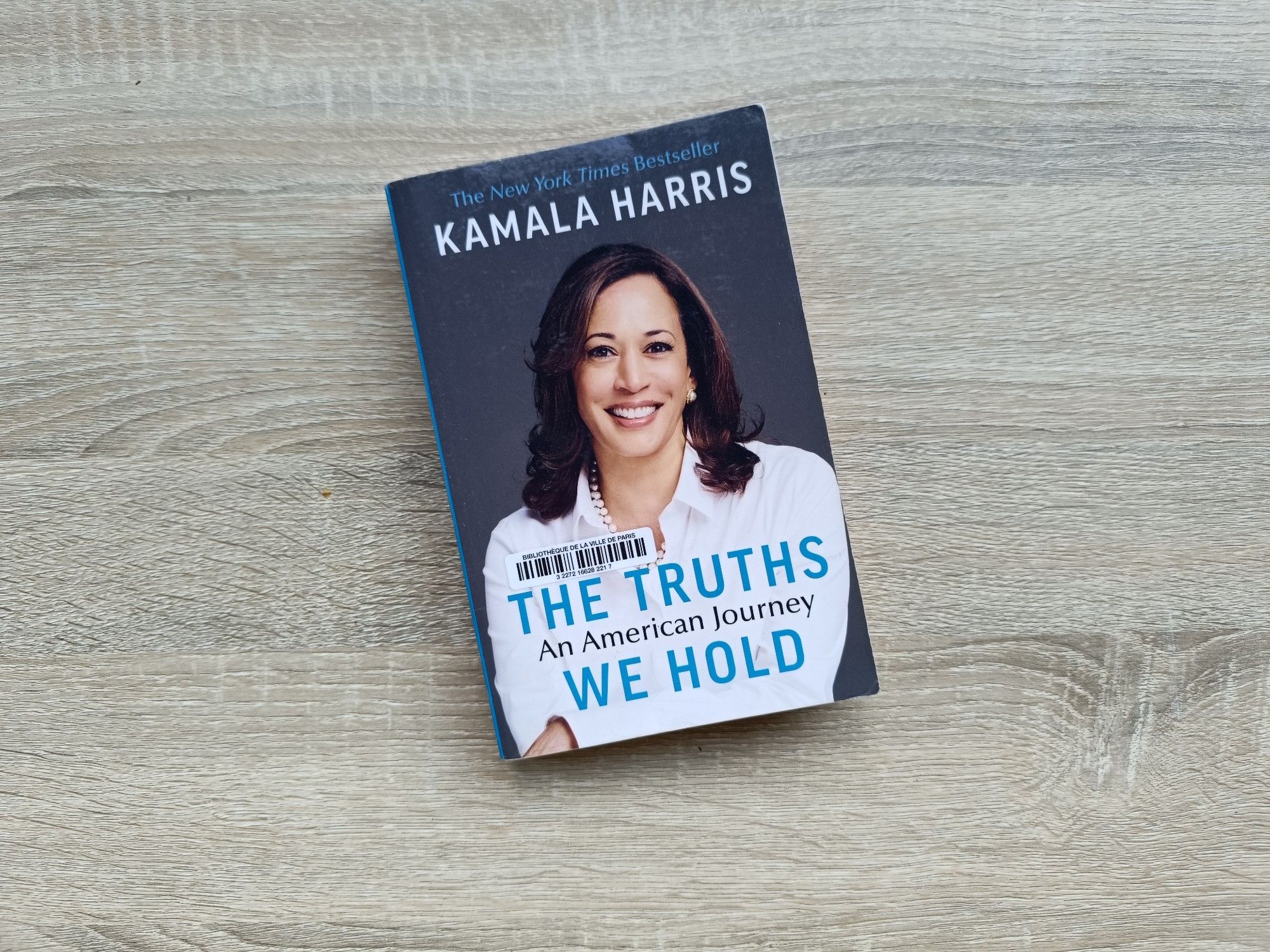 Paperback copy of the book "The Truths We Hold – An American Journey" by Kamala Harris