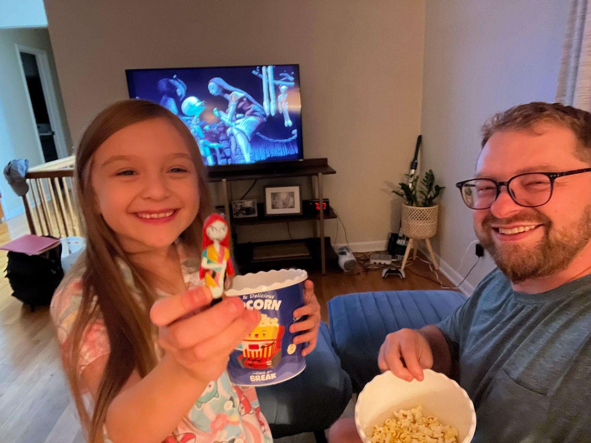 Girl & dad watching Nightmare Before Christmas