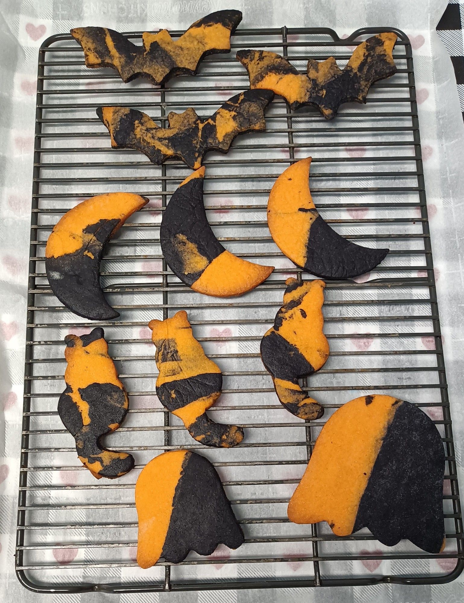 Black and orange cookies in bats, moons, cats and ghosts 