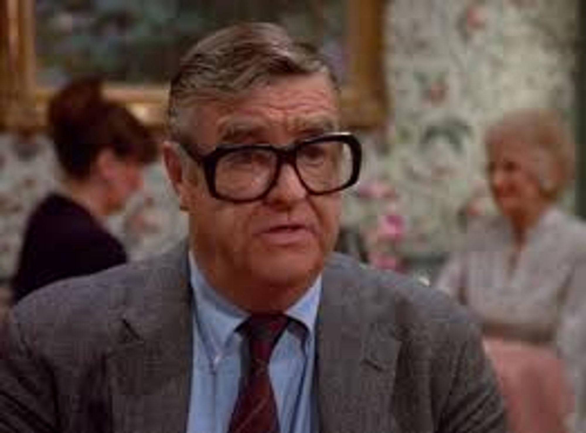 Barney Martin as  Morty Seinfeld wearing comically large glasses