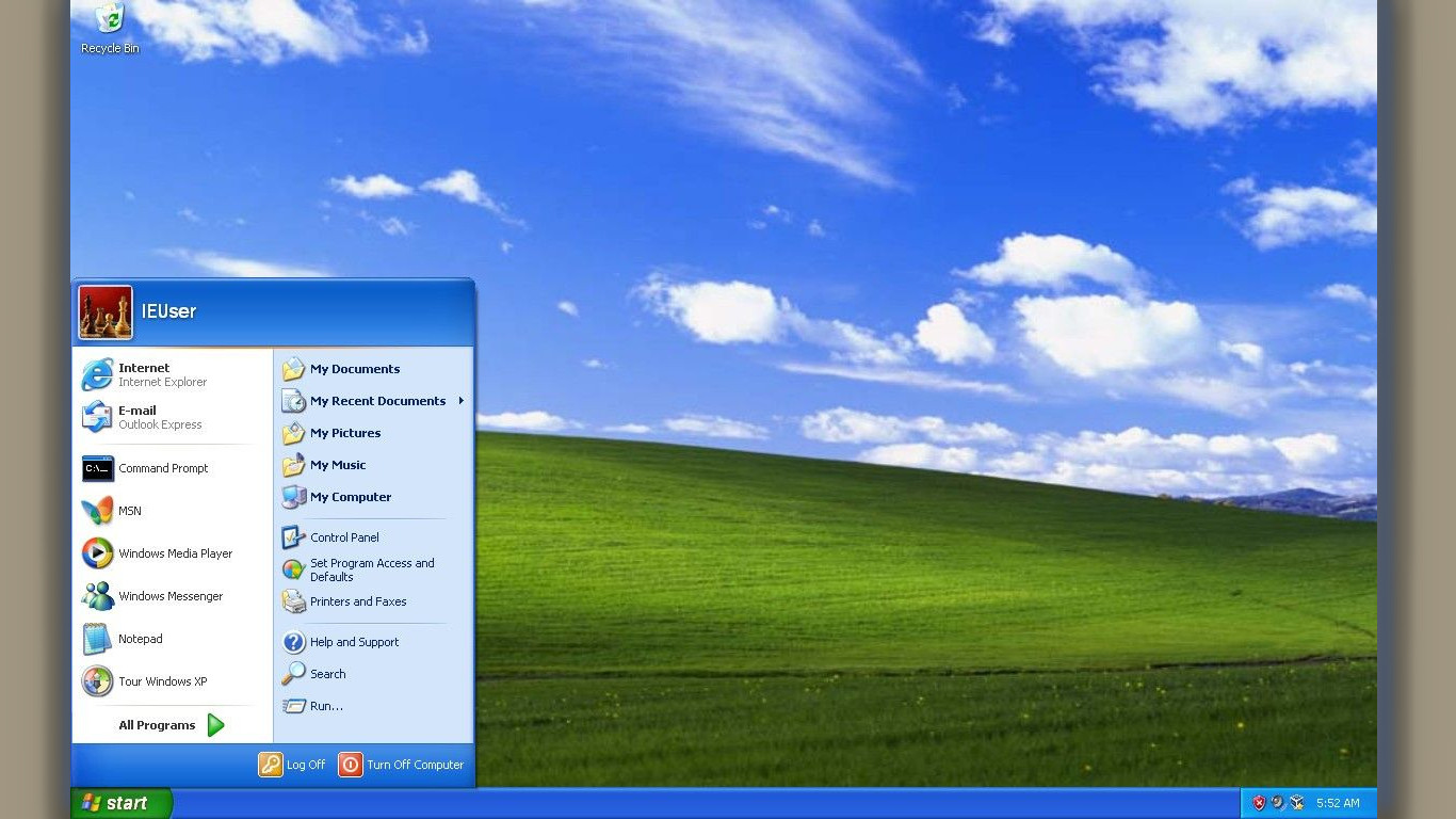 Windows xp workspace with windows tab on, background are green hills with a blue sky