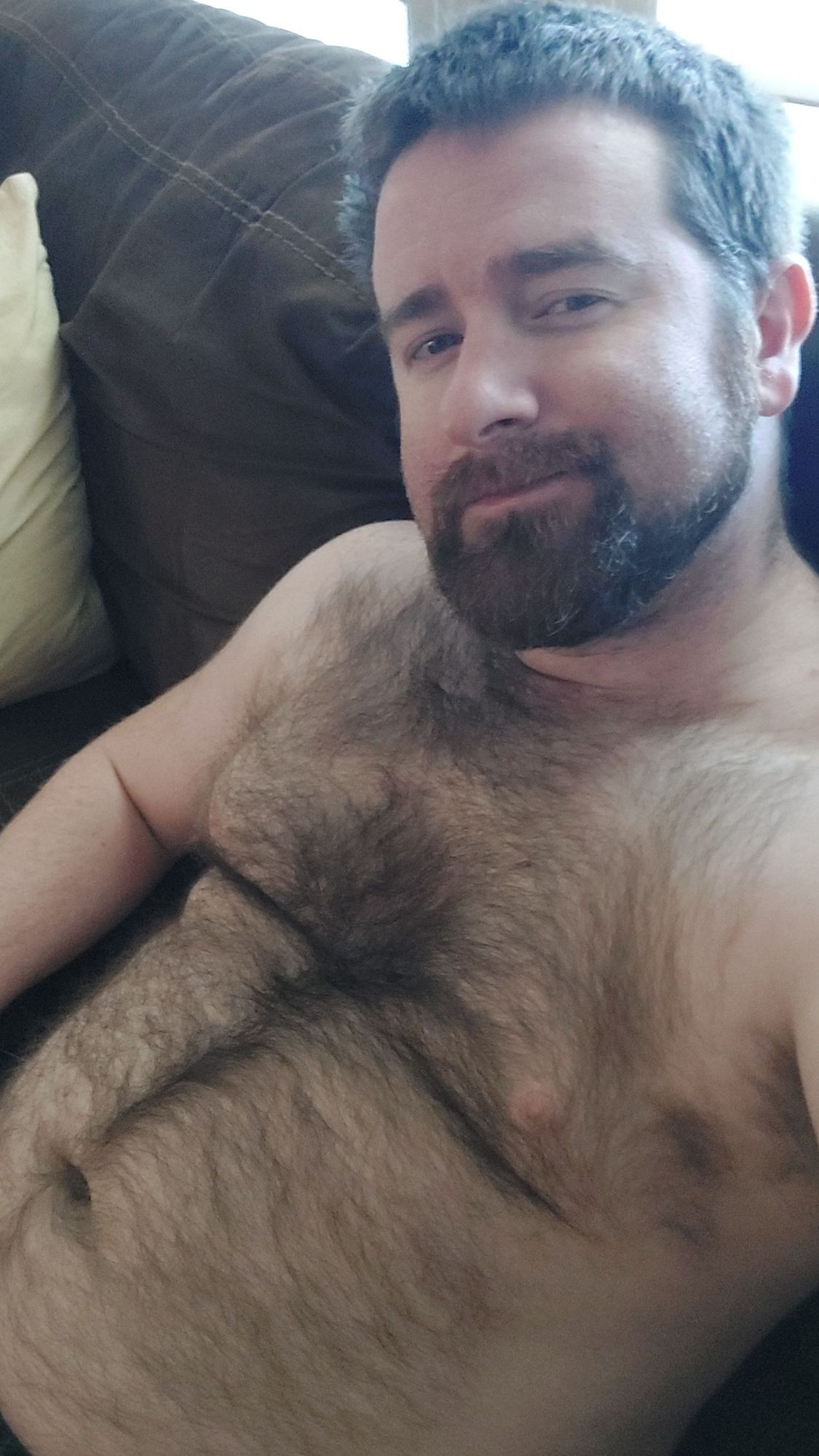 Me on the couch shirtless with my fuzzy belly out for the world to see