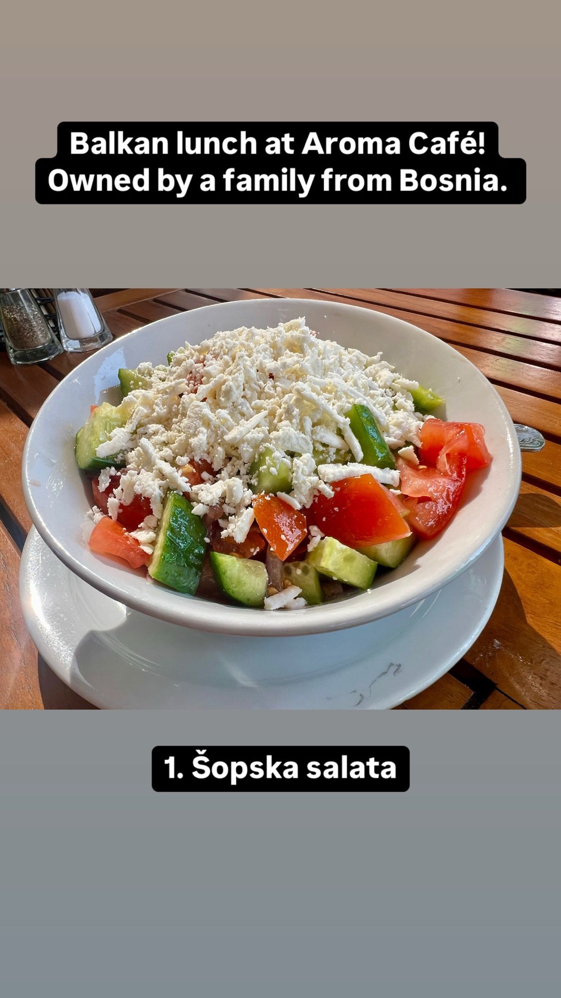 Tomato, cucumber, onion, and pepper salad topped with white cheese.