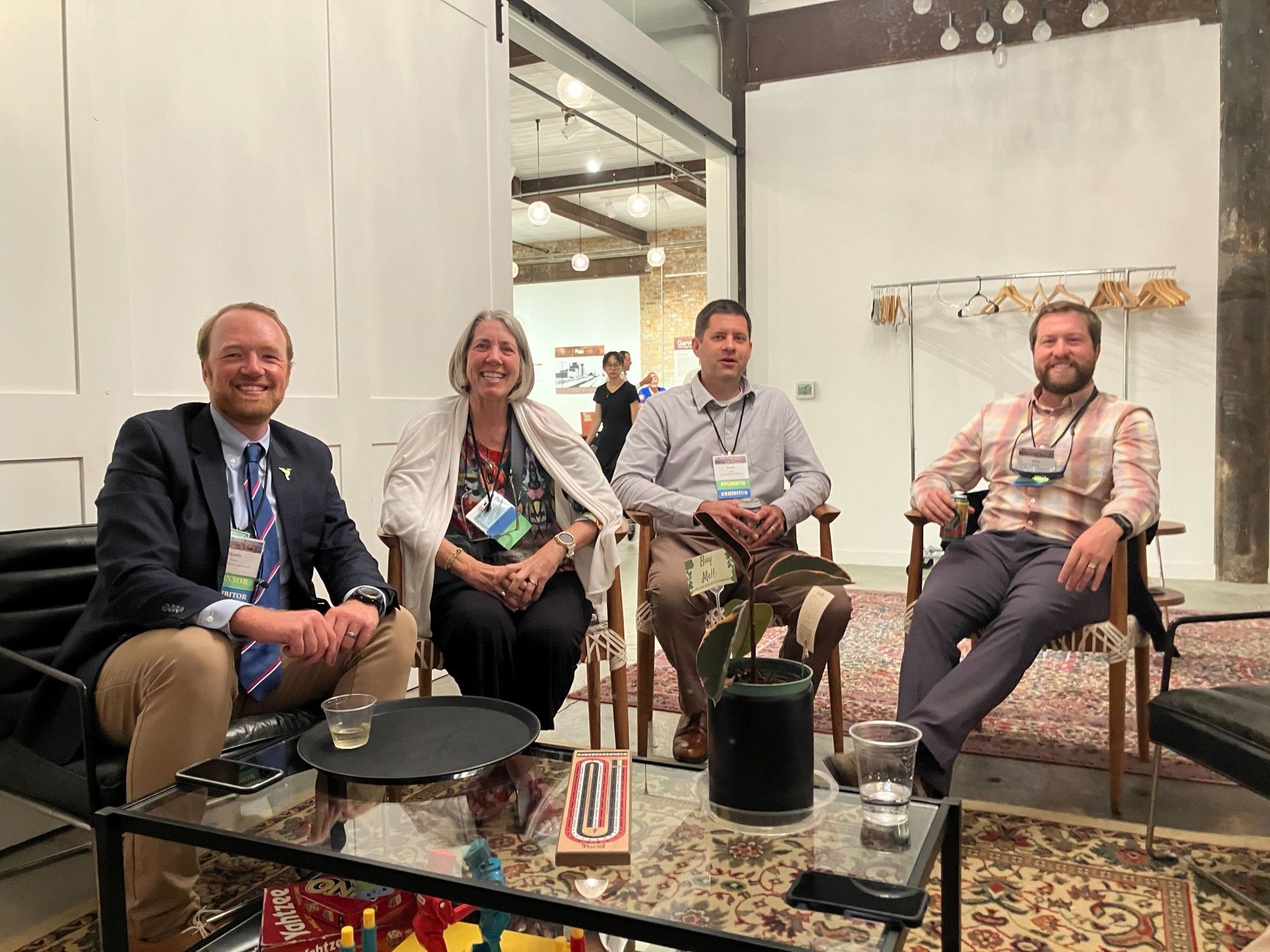 Hardy Kern, Joanna Eckles, Bryan Lenz, and Brian Brooks relax momentarily during the busy conference. Photo by Naamal De Silva.