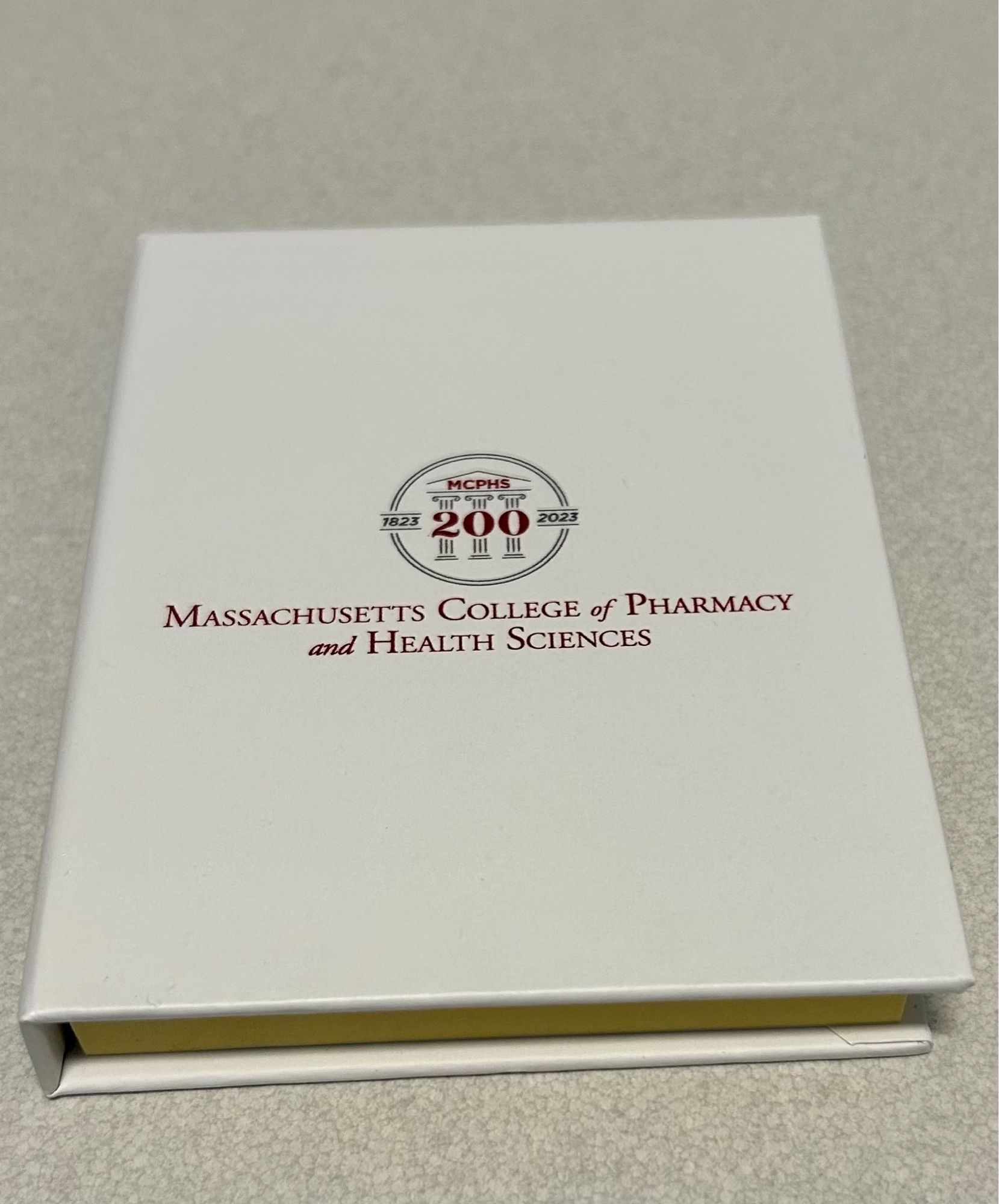 Post-it note book holder with university 200th anniversary logo