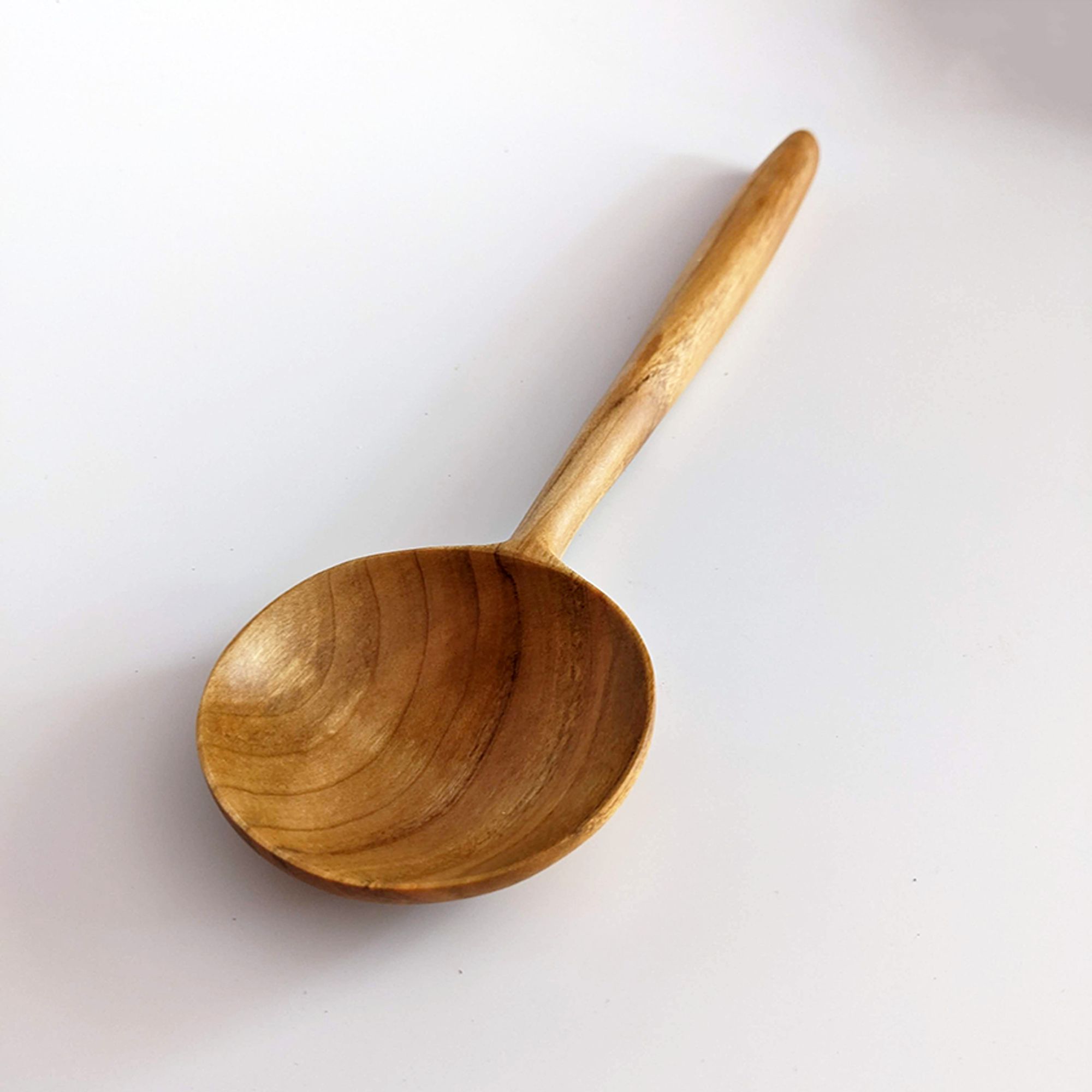 Applewood Spoon with a large circular bowl and straight handle