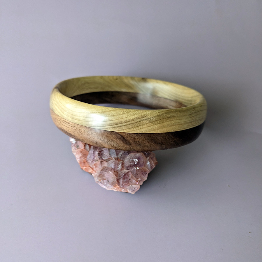 Golden Myrtle wood complements warm toned Walnut in this unique hardwood bangle