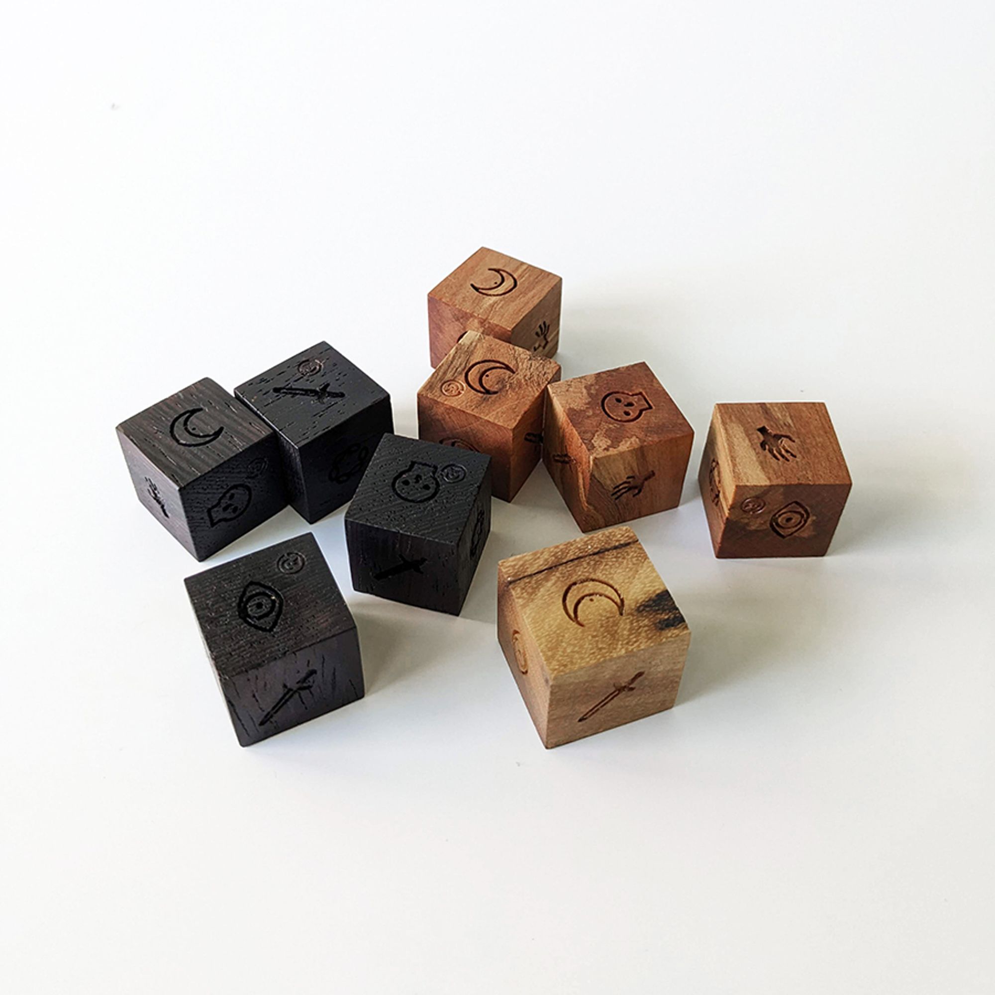 Promo Image of 9 dice. 4 wenge, 4 Madrone, 1 Myrtlewood