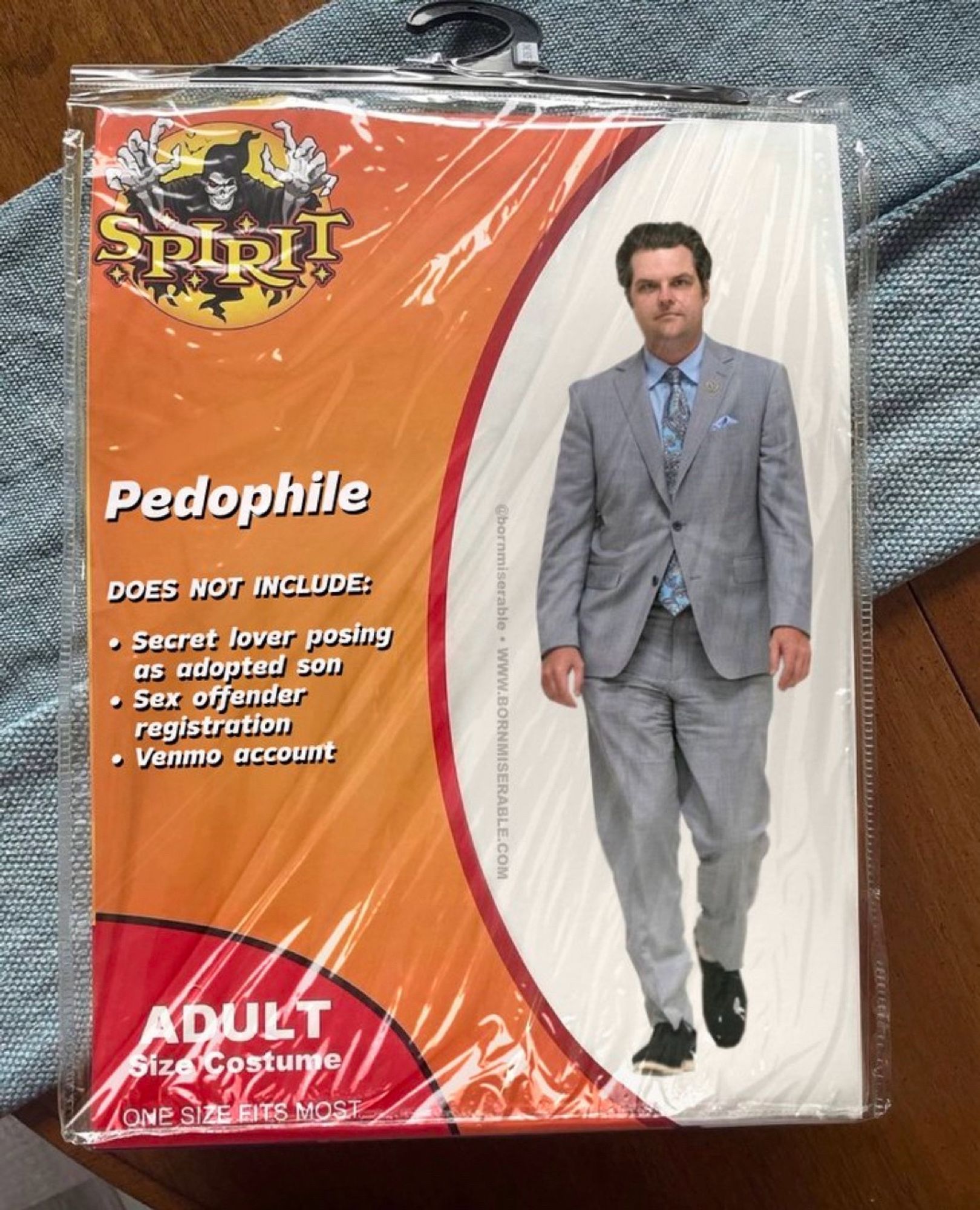 a Photoshop of a Spirit Halloween costume package that reads “PEDOPHILE • DOES NOT INCLUDE: • Secret lover posing as adopted son • Sex offender registration • Venmo account” and “Adult size costume”.  Shows Matt Gaetz in an unfitted, wrinkled gray three piece suit and black and white sneakers with blue shirt and grey tie looking like a life size bobblehead.