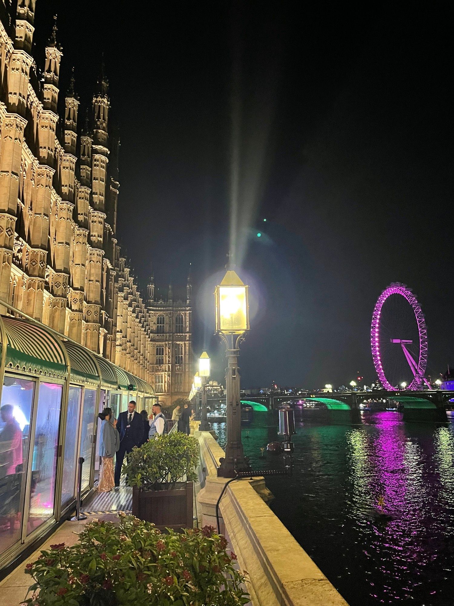 Photo from the terrace of the UK Houses of Parliament with the River Thames & London Eye in the background.