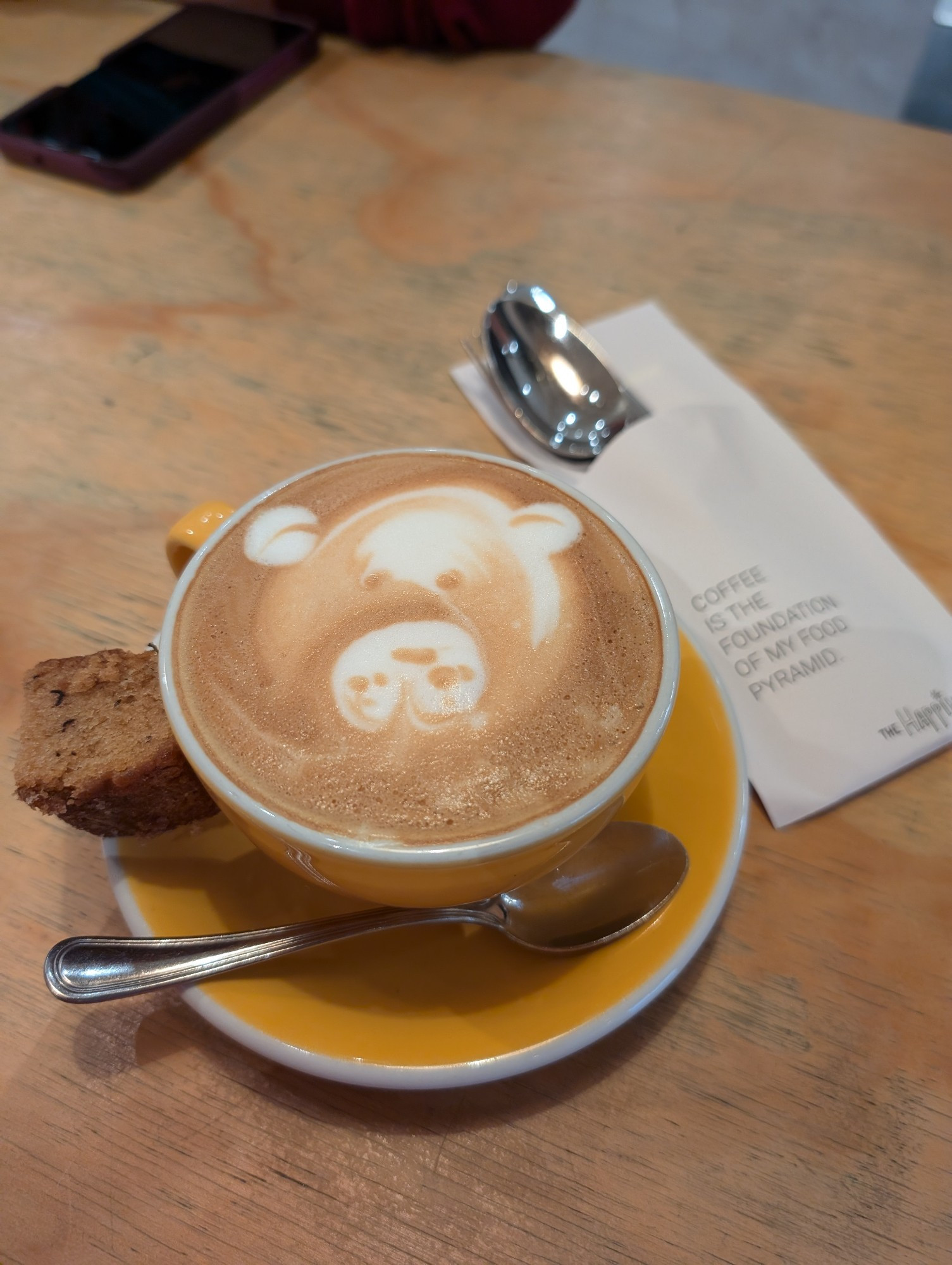 A cappuccino with foam art of a cute bear