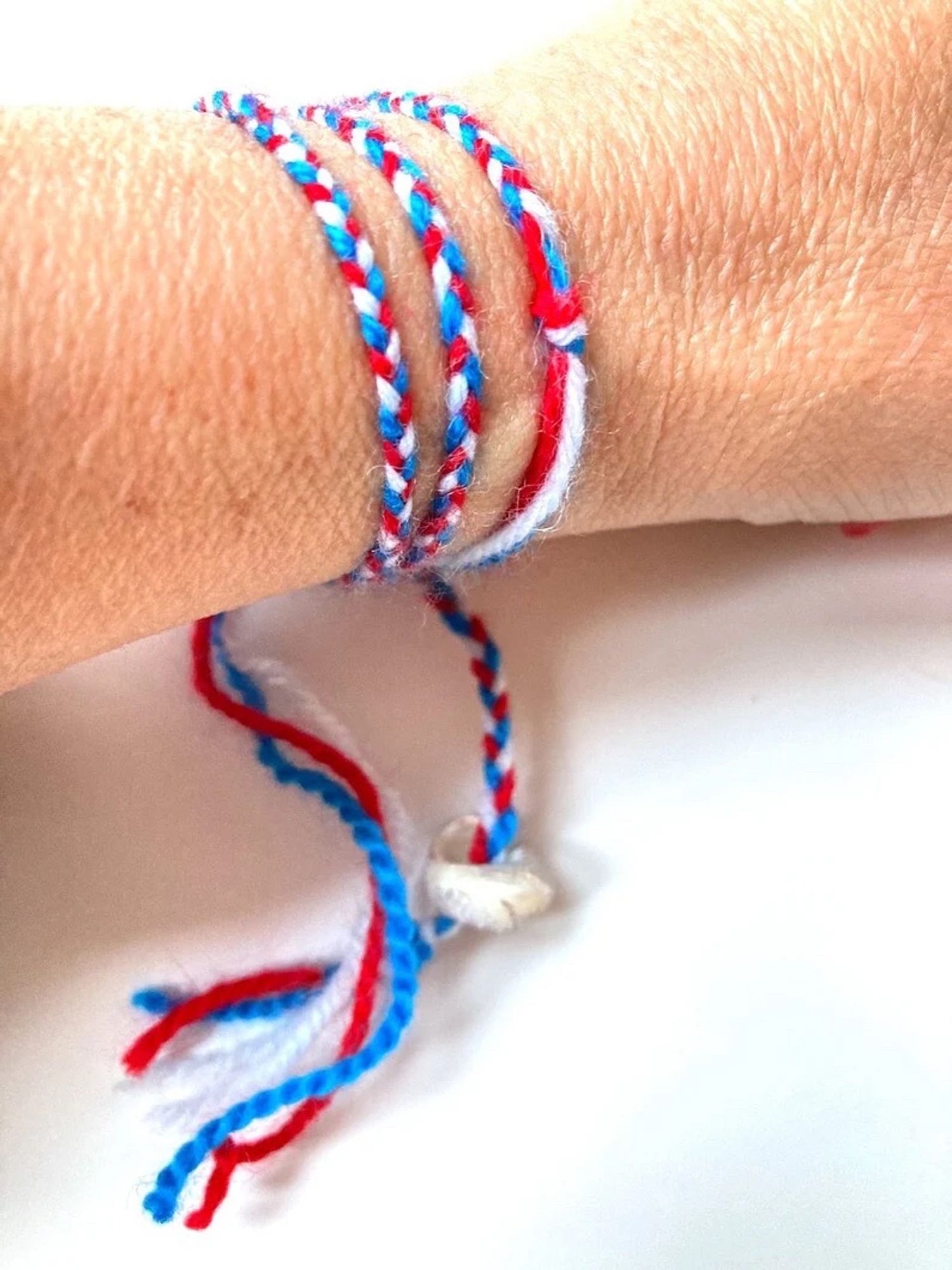 blue red white seashell and wool bracelet