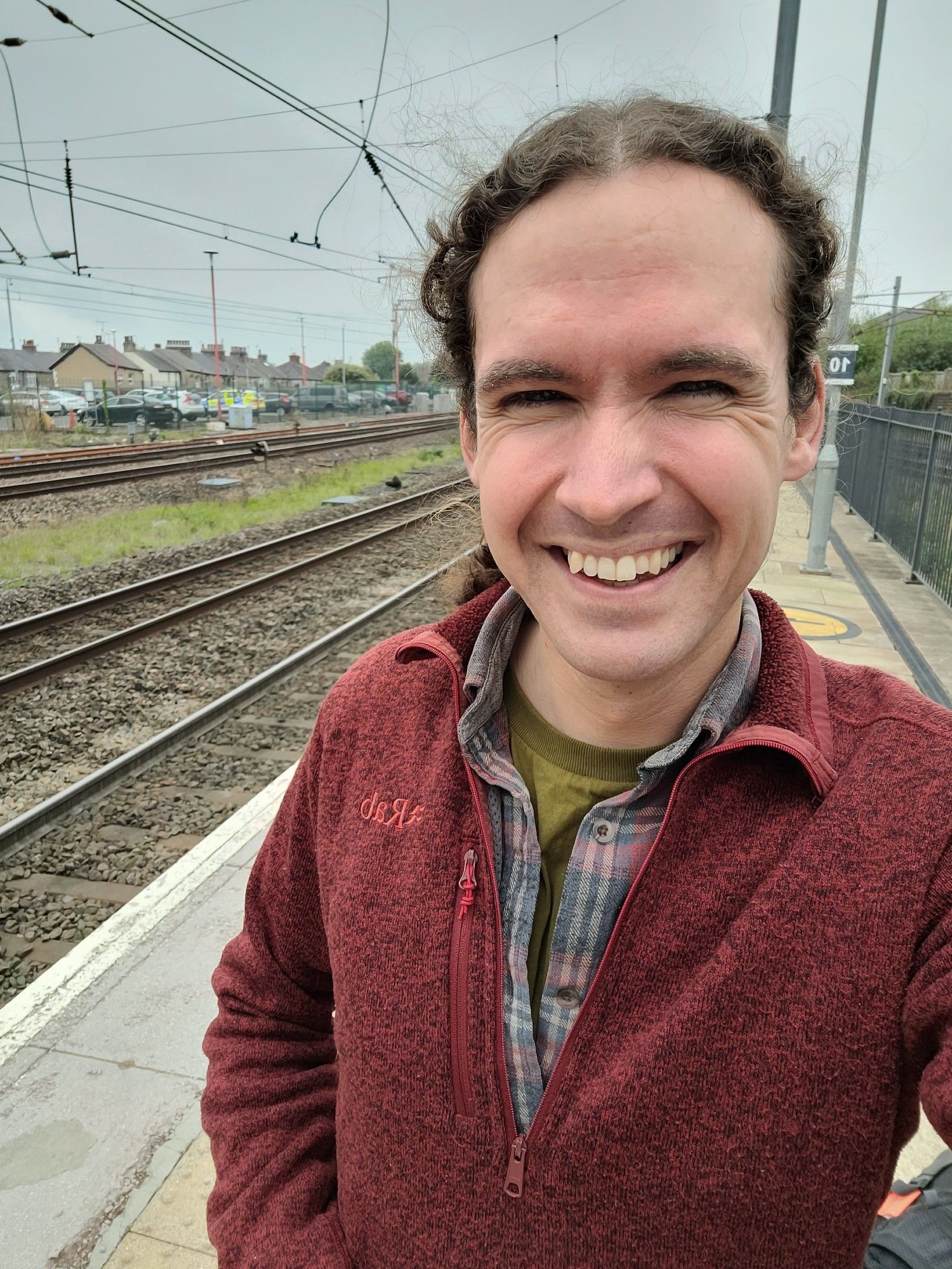 Photo of myself on a platform at a train station.