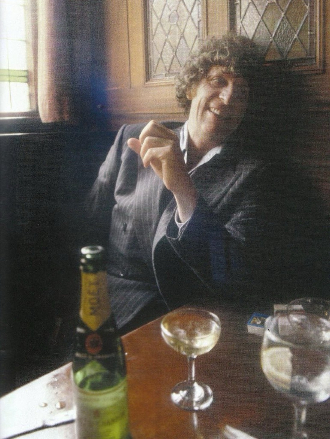 Tom Baker with drinks. 1980.