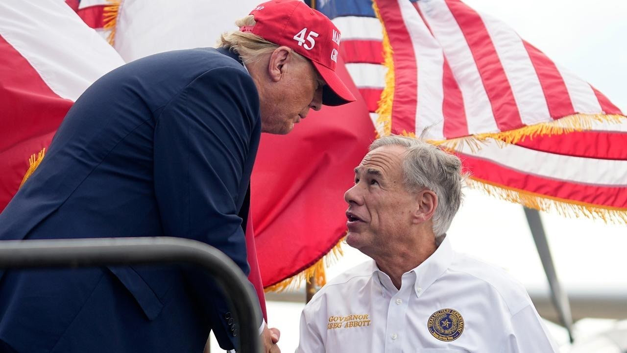 Image of Donald Trump shaking Greg Abbott's hand.