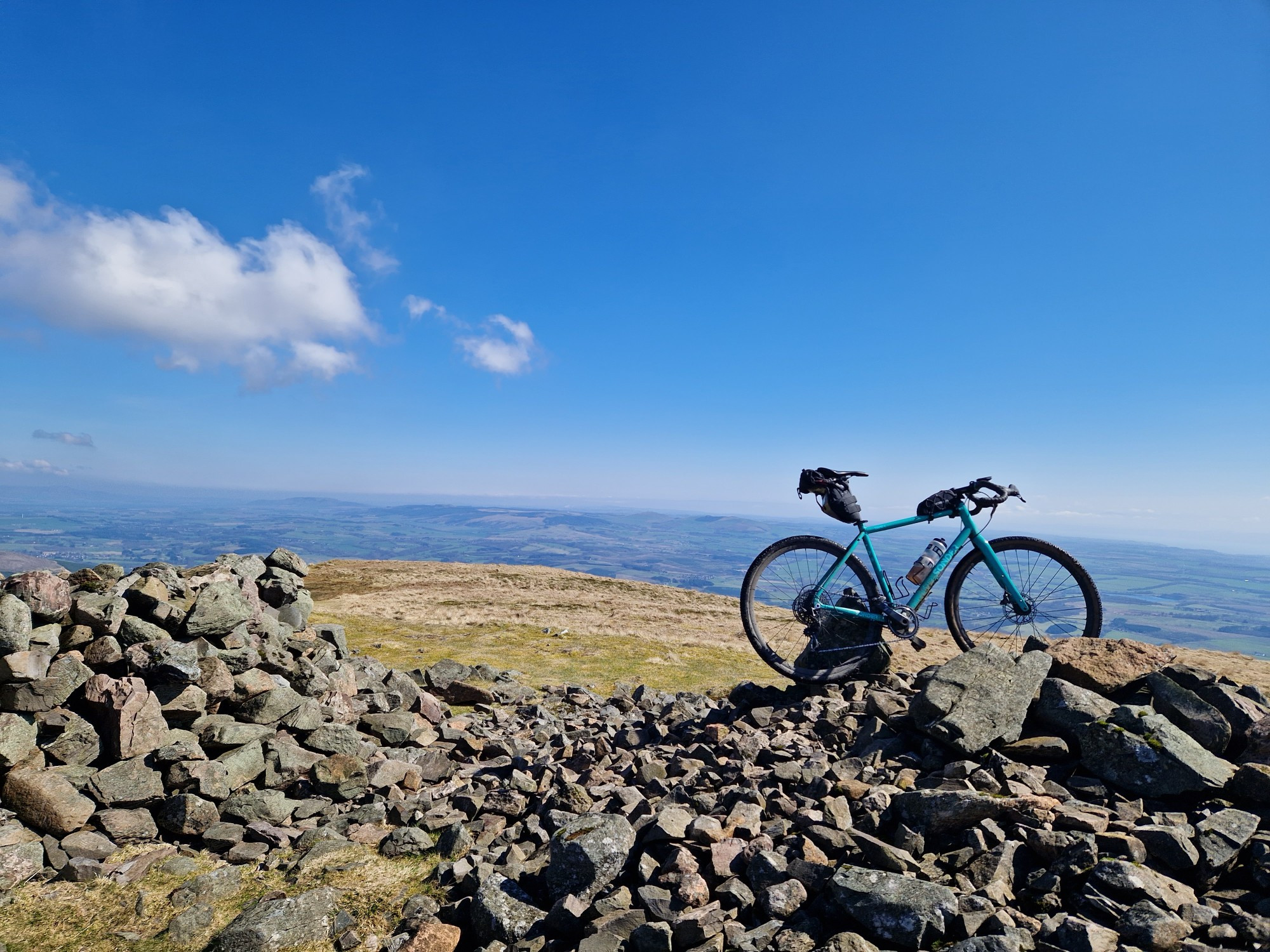 My Trusty Gravel Bike at the top of a bundle of rocks at the top of Saddle Hill above Dollar