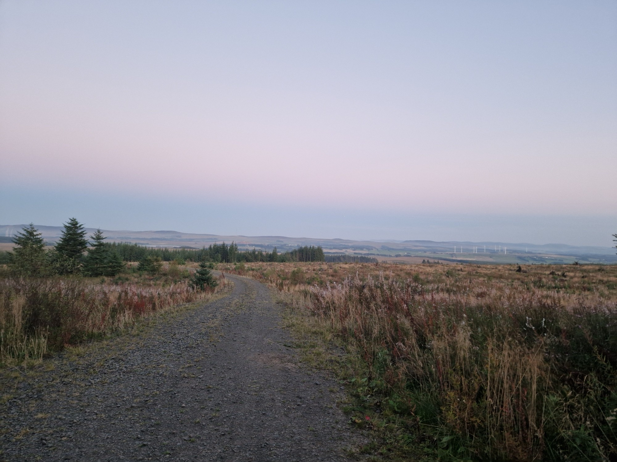 Gravel Road West Lothian at dusk through the Windfarms looking towards the East above West Linton