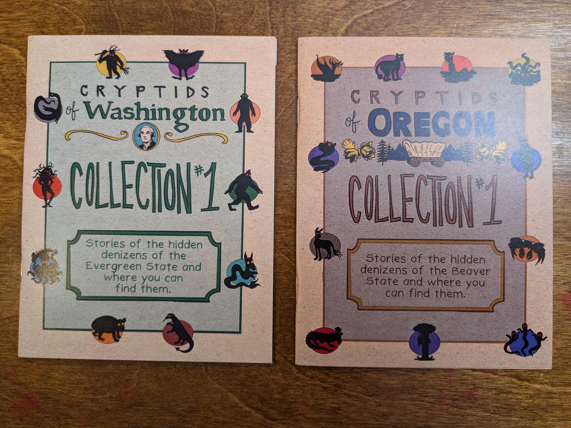 A picture of two zines. On the left Cryptids for Washington and on the right Cryptids from Oregon.