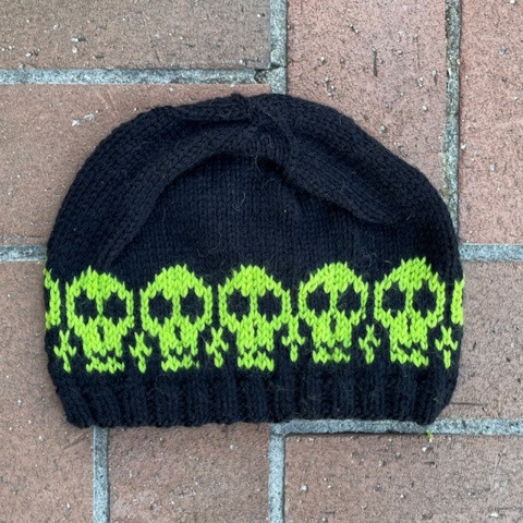 Acid green skulls are a very cool band on this black beanie. 