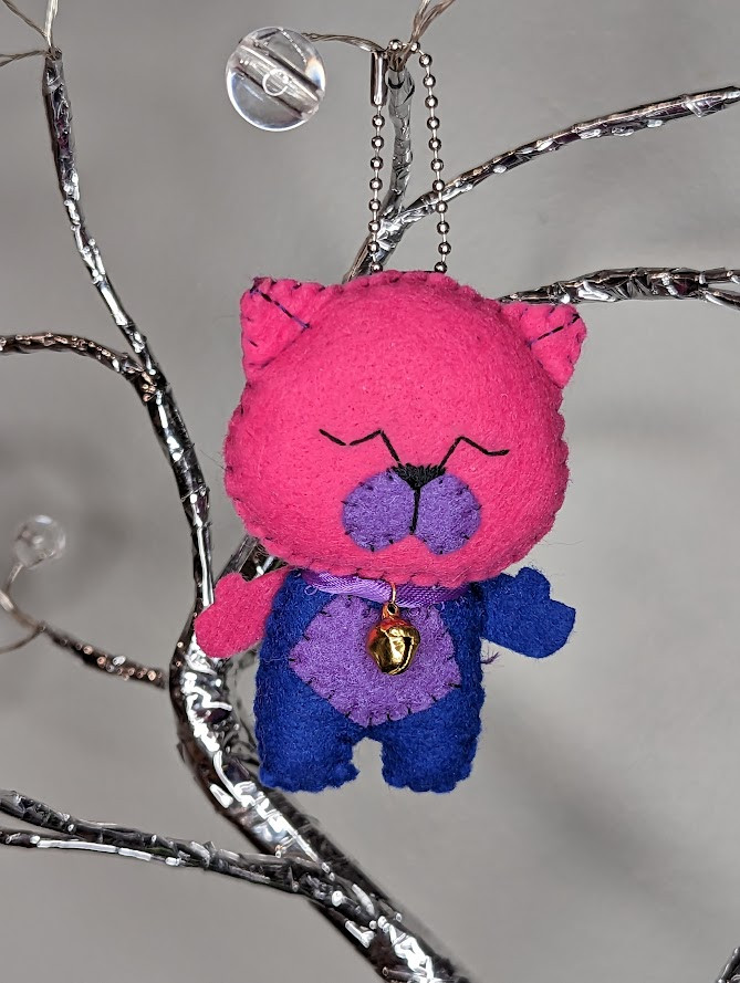 Bisexual Lighing Lucky Neko has a pink head and mostly blue body. It is beautifully lit and very lucky with a bell tied around its neck by lovely lavender ribbon. Stands roughly 3.5” x 1.5” / 7 x 4 cm from ears to tiny feets.