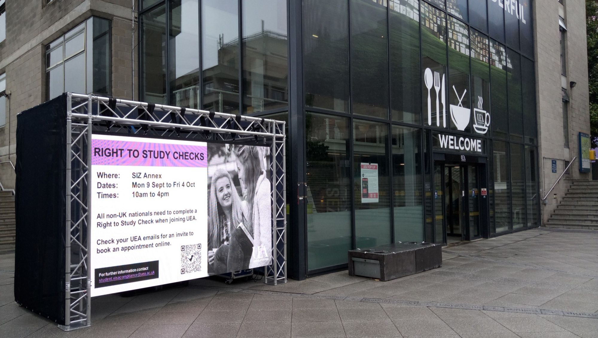 Temporary digital signage in The Square at UEA next to student cafe