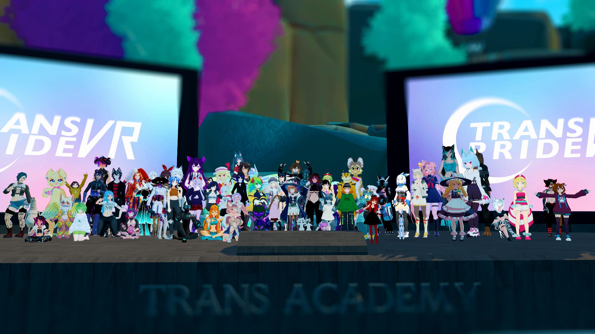 A group picture filled with attendees, panelists, and Trans Academy staff members on the Trans Academy Stage.