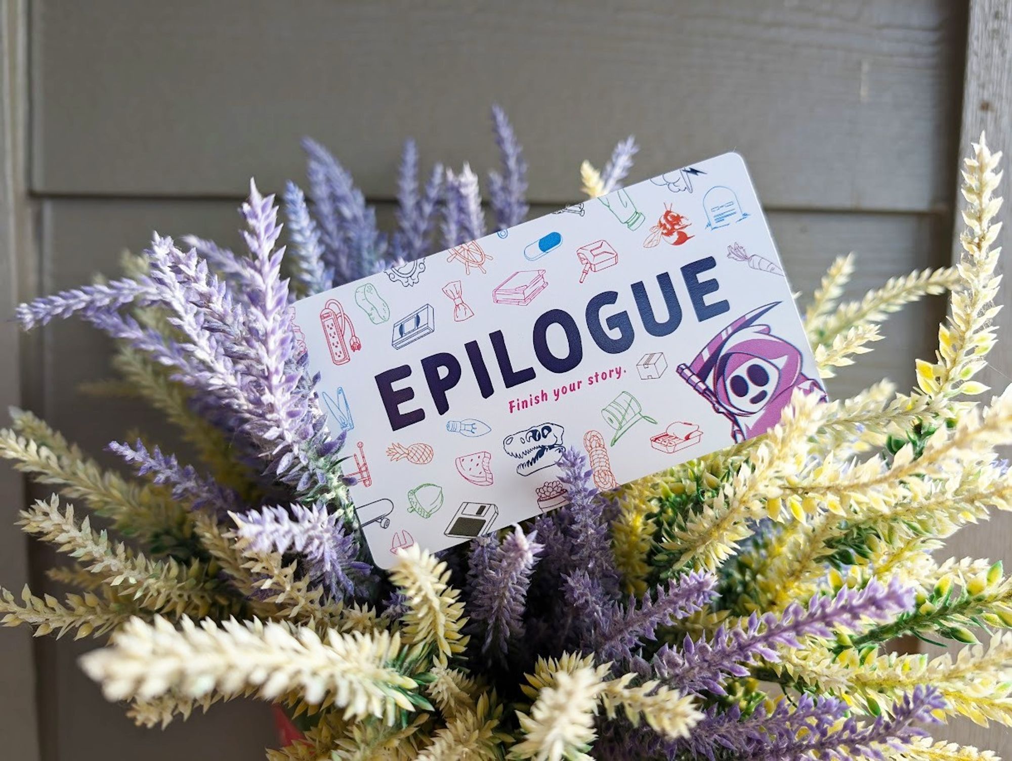 Epilogue card in the middle of a bouquet