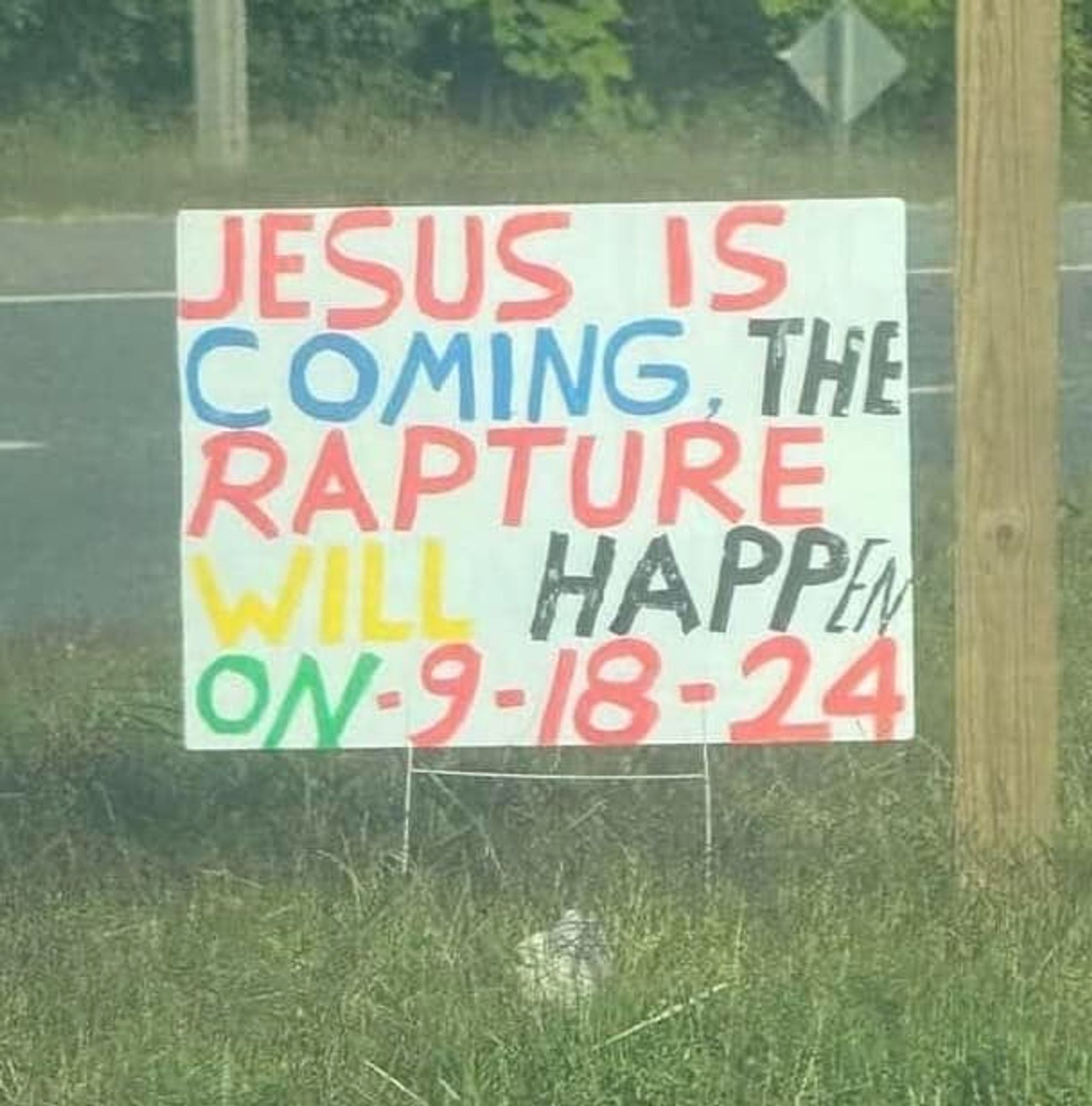 photograph of sign with the text "Jesus is coming, the rapture will happen on -9-18-24"