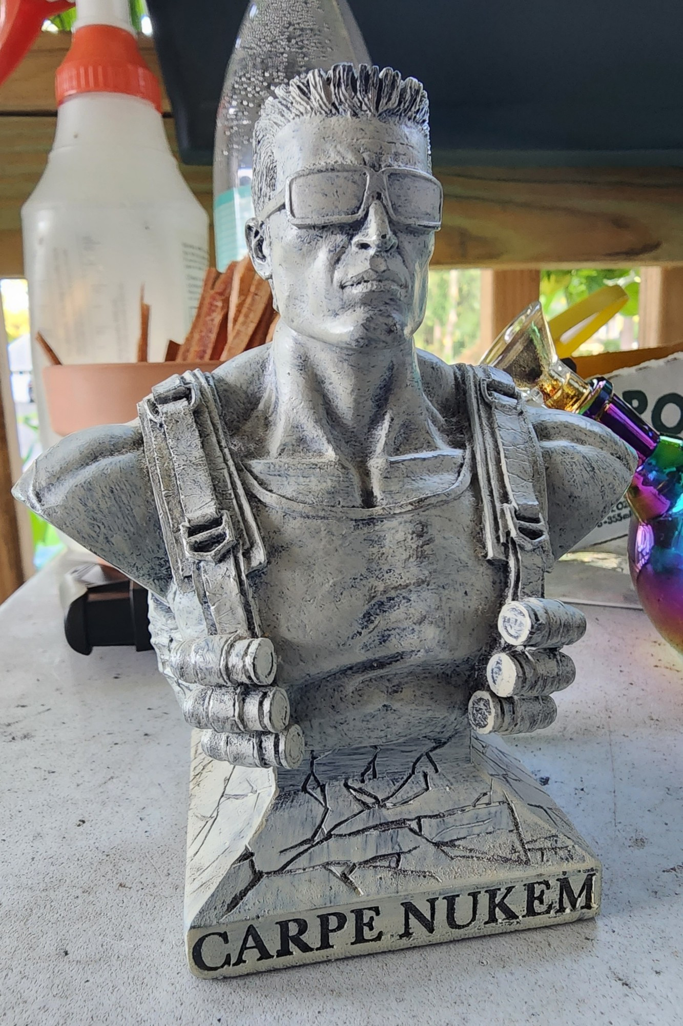 A 6-inch resin cast bust of video-game hero Duke Nukem, with base reading "carpe nukem"