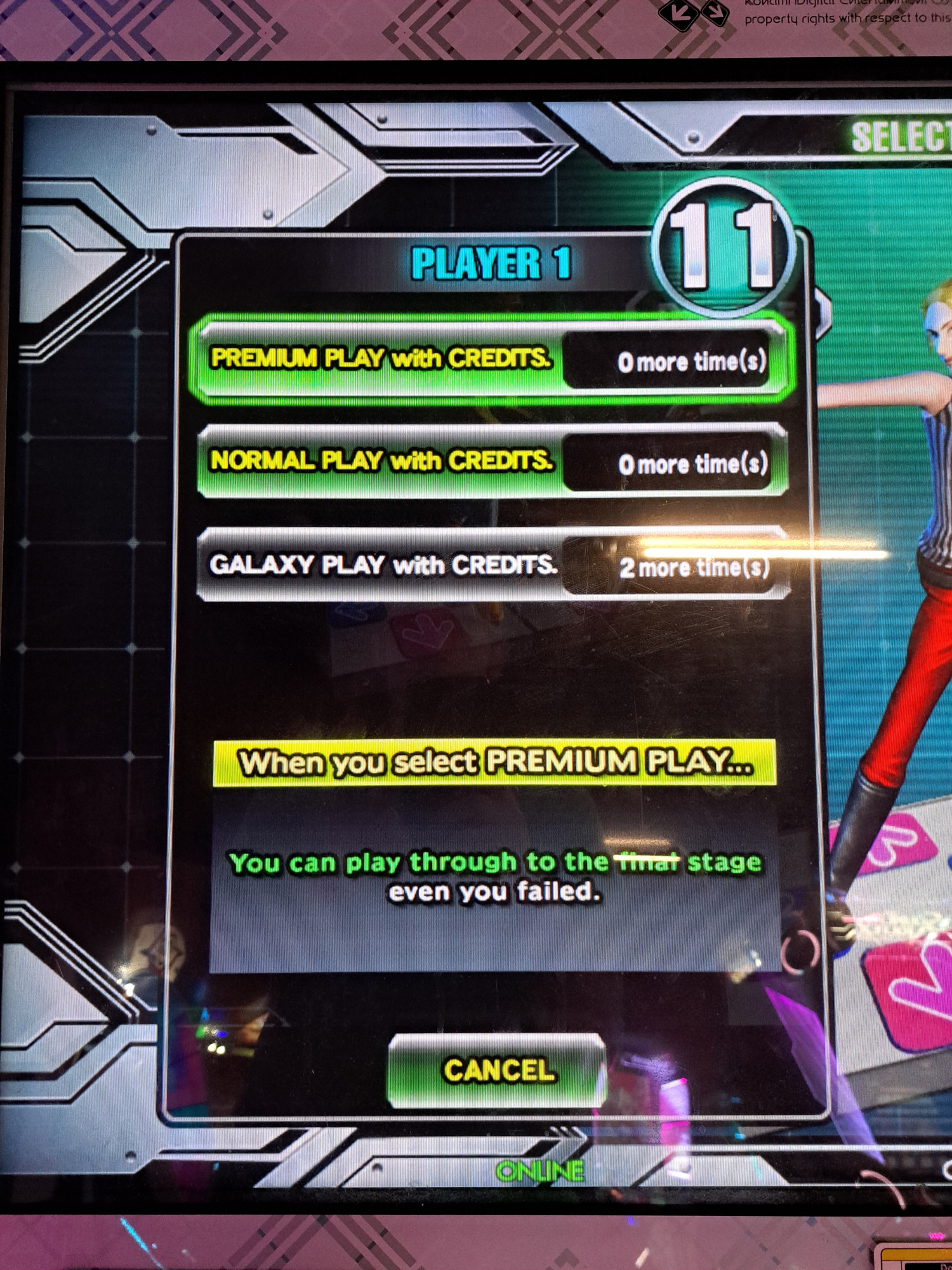 A photo of a menu DanceDanceRevolution A3 (arcade).  The text at the bottom reads "When you select PREMIUM PLAY...  You can play through to the final stage even you failed [sic]".