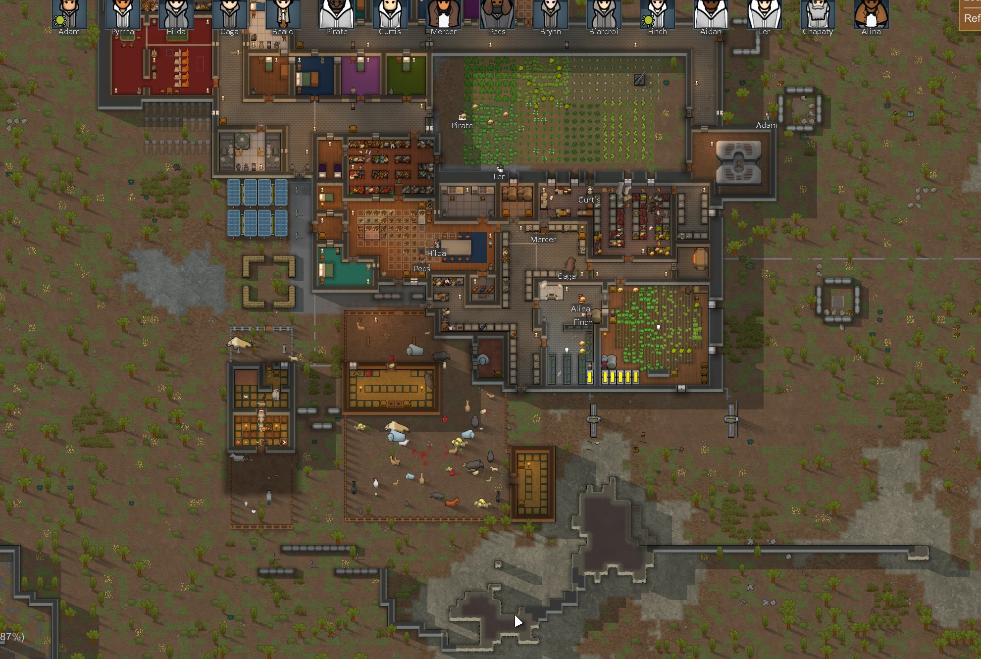 A rimworld colony. The crops are growing in a walled off internal area, and the animals live in wooden pens. There's bloodstains around the  animal pens, for some reason.