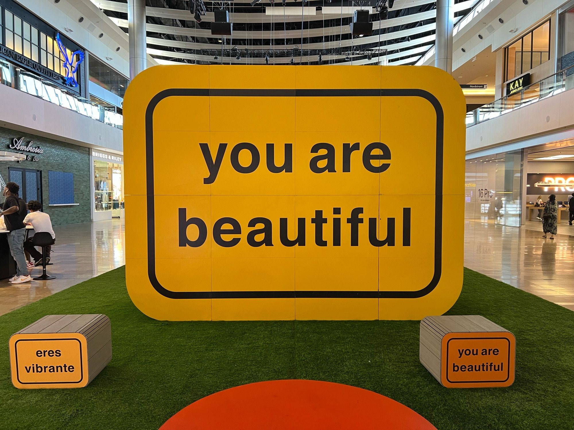 A large display stating “you are beautiful”